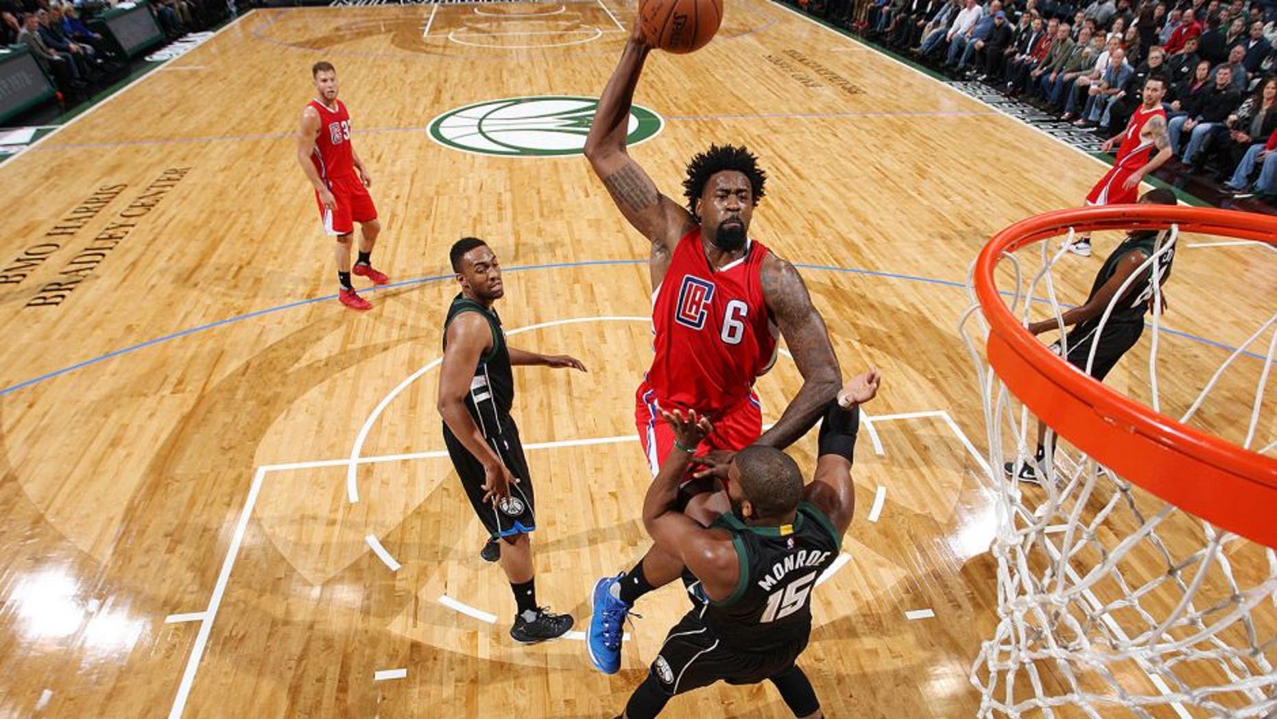 Milwaukee, WI - DECEMBER 9: DeAndre Jordan #6 of the Los Angeles Clippers goes up for a dunk against Greg Monroe #15 of the Milwaukee Bucks on December 9, 2015 at the BMO Harris Bradley Center in Milwaukee, Wisconsin. NOTE TO USER: User expressly acknowledges and agrees that, by downloading and or using this Photograph, user is consenting to the terms and conditions of the Getty Images License Agreement. Mandatory Copyright Notice: Copyright 2015 NBAE (Photo by Gary Dineen/NBAE via Getty Images)