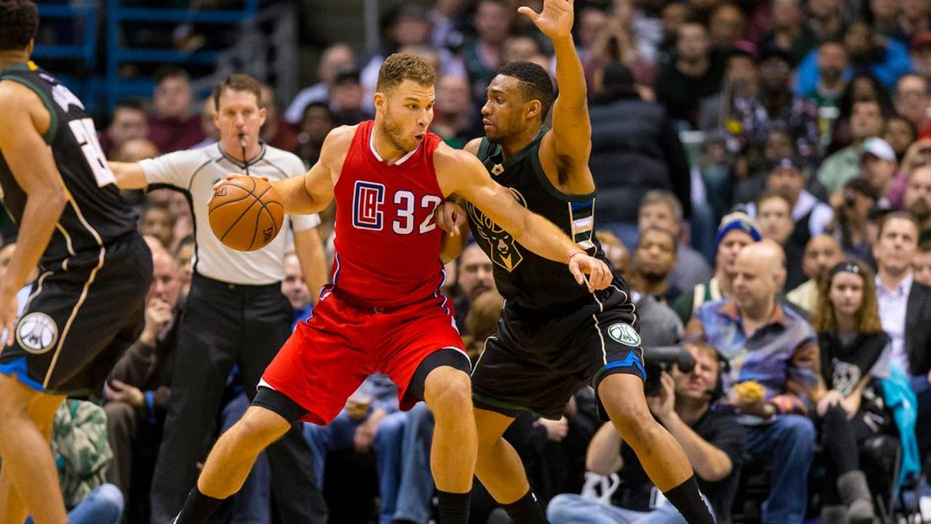 Dec 9, 2015; Milwaukee, WI, USA; Los Angeles Clippers forward Blake Griffin (32) drives for the basket as Milwaukee Bucks forward Jabari Parker (12) defends during the fourth quarter at BMO Harris Bradley Center. The Clippers won 109-95. Mandatory Credit: Jeff Hanisch-USA TODAY Sports