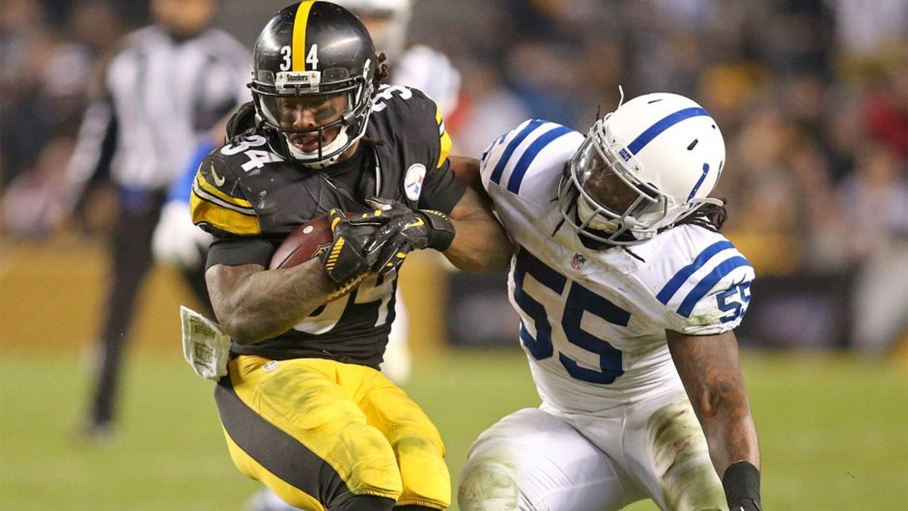 Dec 6, 2015; Pittsburgh, PA, USA; aPittsburgh Steelers running back DeAngelo Williams (34) runs gainst Indianapolis Colts inside linebacker Nate Irving (55)during the fourth quarter at Heinz Field. The Steelers won 45-10. Mandatory Credit: Charles LeClaire-USA TODAY Sports