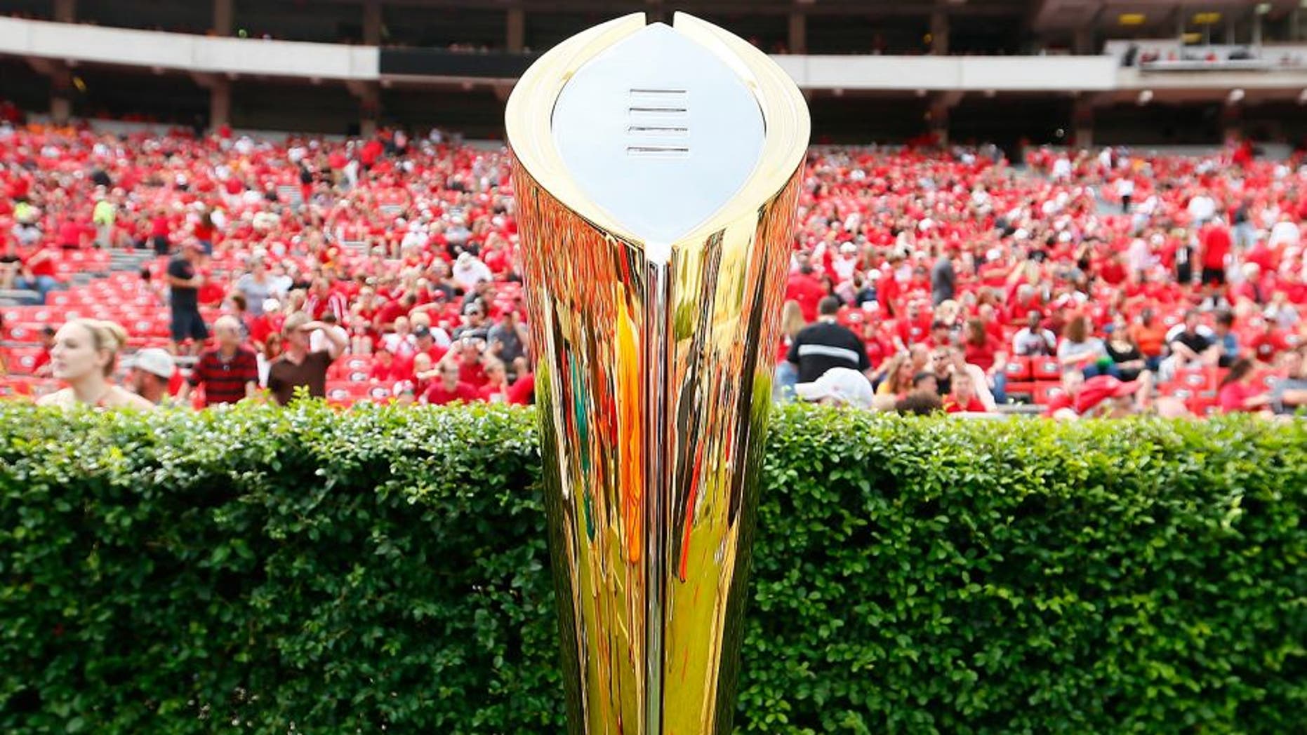 ATHENS, GA - SEPTEMBER 27: The College Football Playoff National Championship Trophy is seen on the field prior to the game between the Georgia Bulldogs and the Tennessee Volunteers at Sanford Stadium on September 27, 2014 in Athens, Georgia. (Photo by Kevin C. Cox/Getty Images)