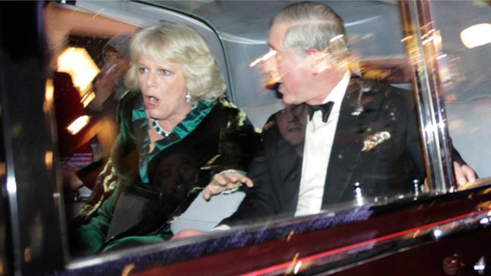 Dec. 9: Britain's Prince Charles and Camilla, Duchess of Cornwall react as their car is attacked in London.