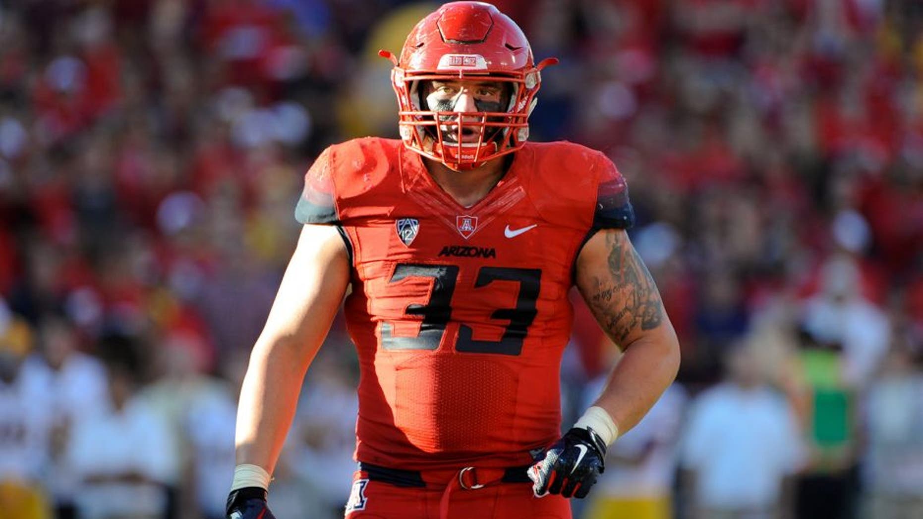 Nov 28, 2014; Tucson, AZ, USA; Arizona Wildcats linebacker Scooby Wright III (33) looks to the sideline during the third quarter of the territorial cup against the Arizona State Sun Devils at Arizona Stadium. The Wildcats won 42-35. Mandatory Credit: Casey Sapio-USA TODAY Sports