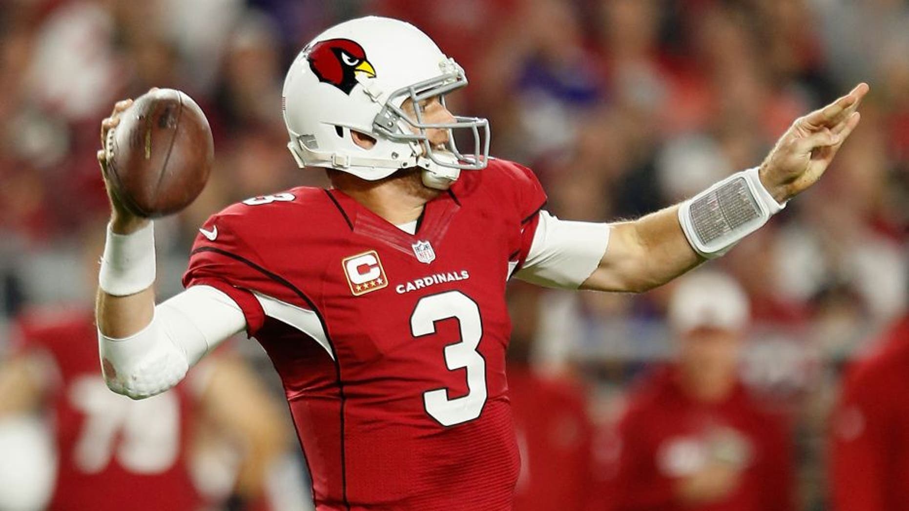 GLENDALE, AZ - DECEMBER 10: Quarterback Carson Palmer #3 of the Arizona Cardinals makes a pass to wide receiver Michael Floyd #15 (not pictured) who scored a 65 yard touchdown during the second quarter of the NFL game against Minnesota Vikings at the University of Phoenix Stadium on December 10, 2015 in Glendale, Arizona. (Photo by Christian Petersen/Getty Images)
