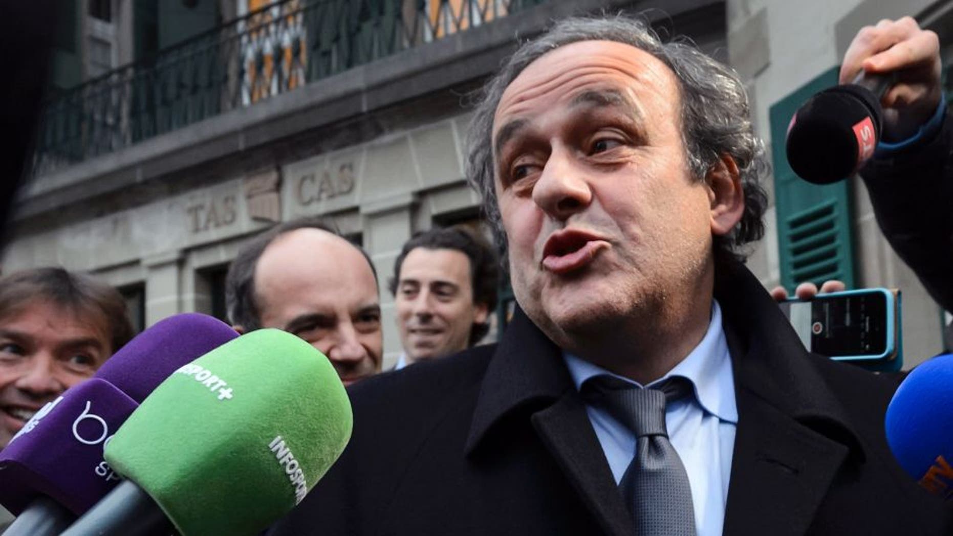 UEFA president Michel Platini answers journalists' questions as he leaves the Court of Arbitration for Sport (CAS) after an hearing for an appeal against a 90-day suspension on December 8, 2015 in Lausanne. FIFA vice-president Michel Platini vowed to tell "nothing but the truth" before appearing at the Court of Arbitration for Sport (CAS) in a bid to halt a 90-day suspension by football's world body. / AFP / FABRICE COFFRINI (Photo credit should read FABRICE COFFRINI/AFP/Getty Images)