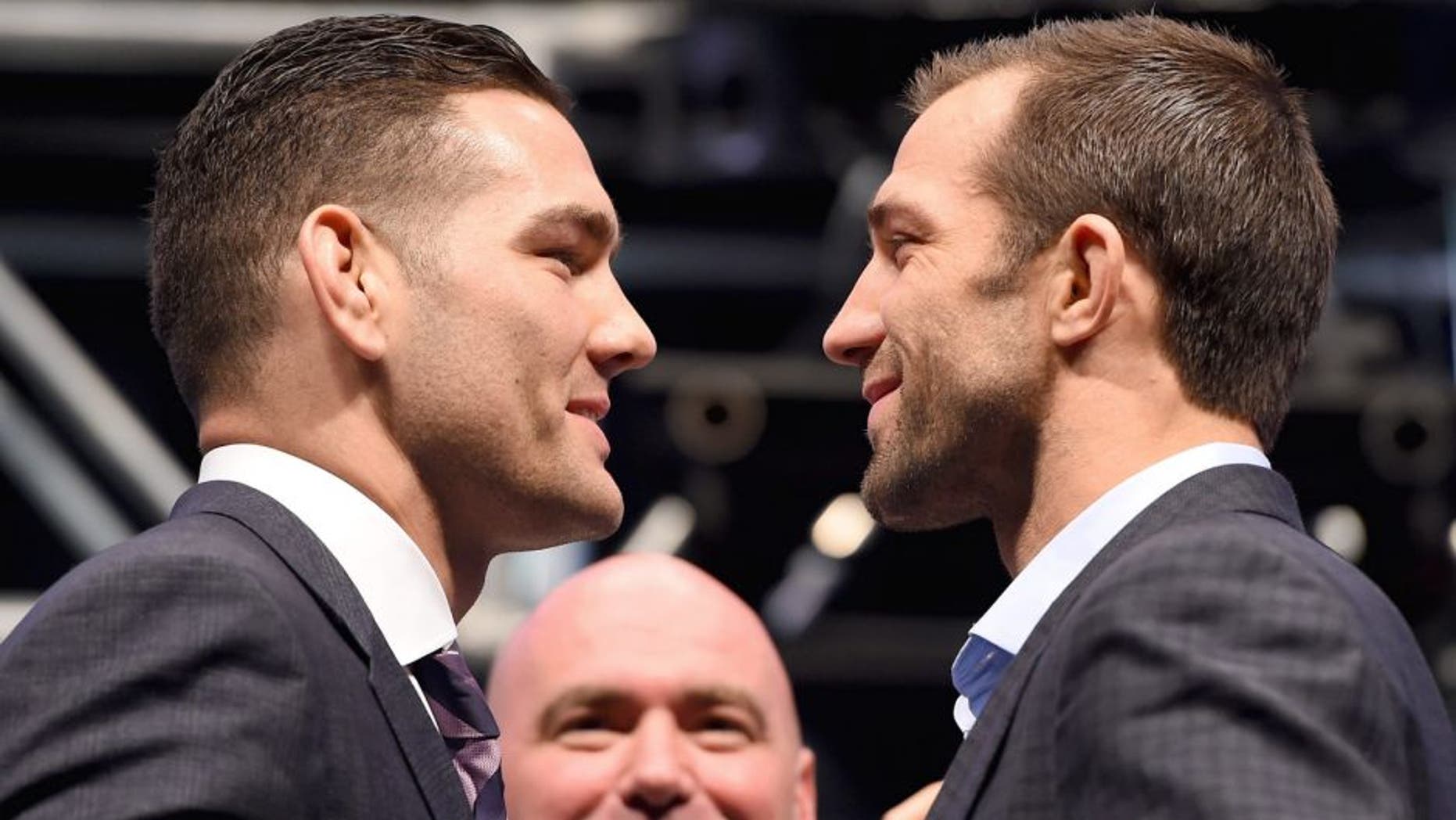LAS VEGAS, NV - DECEMBER 09: (L-R) Opponents Chris Weidman and Luke Rockhold face off during the UFC Press Conference inside MGM Grand Garden Arena on December 9, 2015 in Las Vegas, Nevada. (Photo by Josh Hedges/Zuffa LLC/Zuffa LLC via Getty Images)