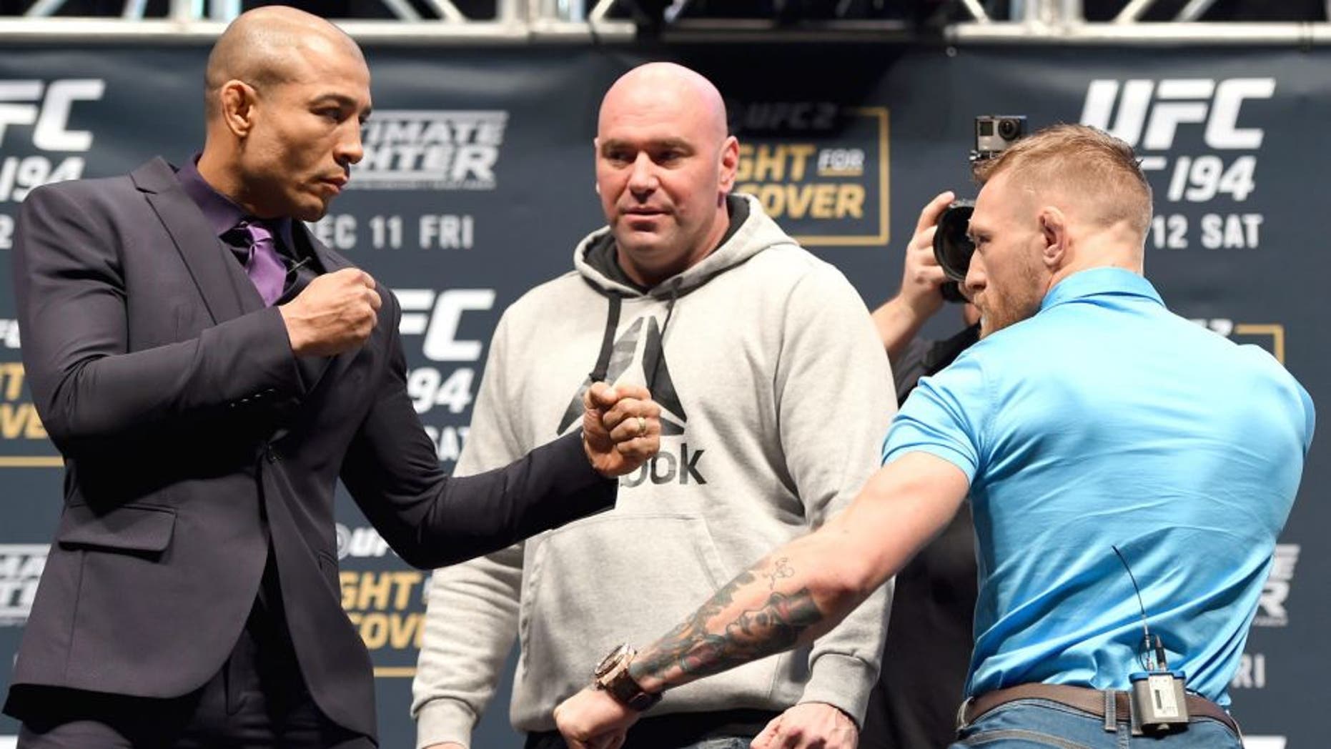 LAS VEGAS, NV - DECEMBER 09: (L-R) Opponents Jose Aldo of Brazil and Conor McGregor of Ireland face off during the UFC Press Conference inside MGM Grand Garden Arena on December 9, 2015 in Las Vegas, Nevada. (Photo by Josh Hedges/Zuffa LLC/Zuffa LLC via Getty Images)