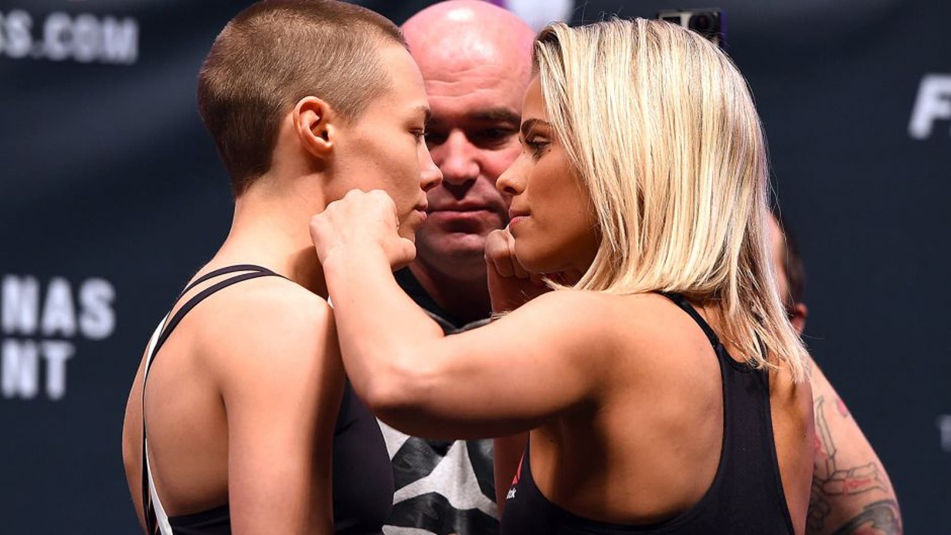 LAS VEGAS, NV - DECEMBER 09: (L-R) Opponents Rose Namajunas and Paige VanZant face off during the UFC Fight Night weigh-in inside MGM Grand Garden Arena on December 9, 2015 in Las Vegas, Nevada. (Photo by Josh Hedges/Zuffa LLC/Zuffa LLC via Getty Images)