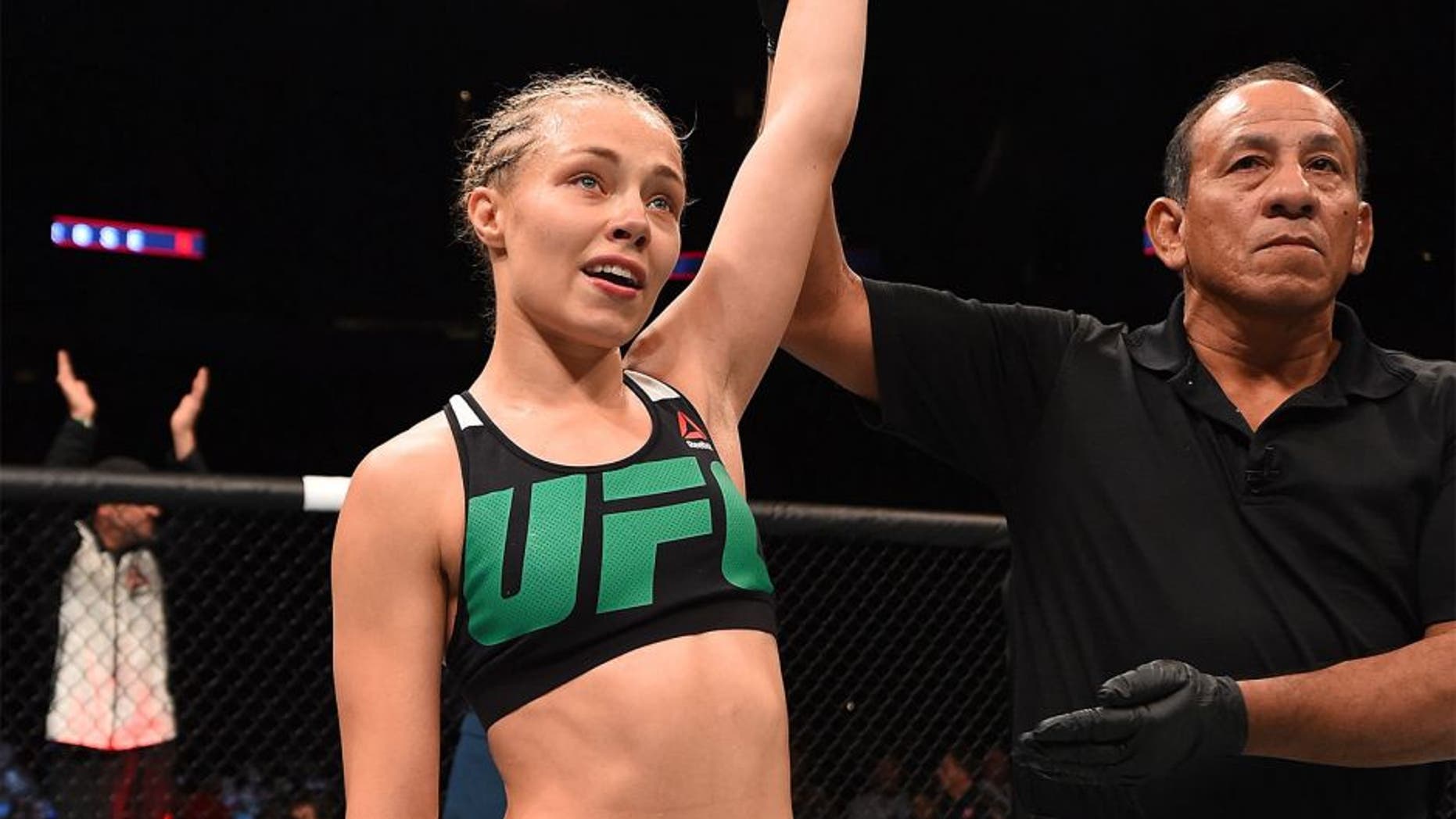 HOUSTON, TX - OCTOBER 03: Rose Namajunas celebrates her submission victory over Angela Hill in their women's strawweight bout during the UFC 192 event at the Toyota Center on October 3, 2015 in Houston, Texas. (Photo by Josh Hedges/Zuffa LLC/Zuffa LLC via Getty Images)