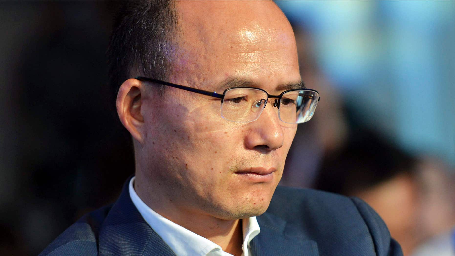 In this June 25, 2015 photo, Guo Guangchang attends the opening ceremony of the new Internet bank MYbank in Hangzhou in east China's Zhejiang province.