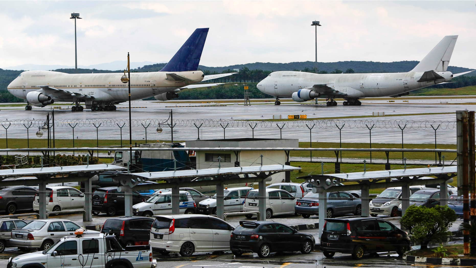 Dec. 9, 2015: Left to right, two of the three abandoned planes with tail numbers, TF-ARM and TF-ARN are seen taxied on the tarmac of Kuala Lumpur International Airport in Sepang, Malaysia.