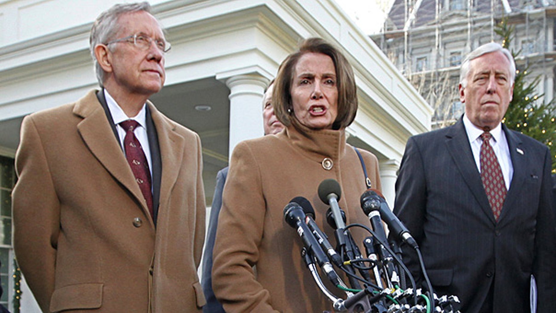 Dec. 9: House Speaker Nancy Pelosi is flanked by Senate Majority Leader Harry Reid, left, and House Majority Leader Steny Hoyer, outside the White House.