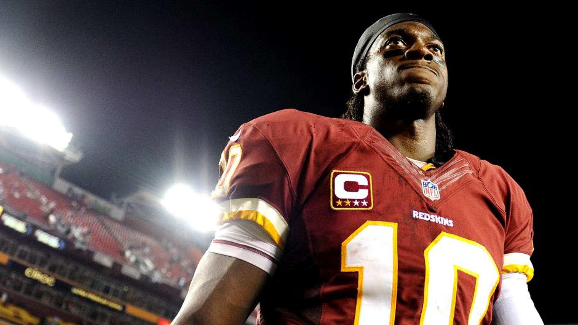 LANDOVER, MD - SEPTEMBER 09: Quarterback Robert Griffin III #10 of the Washington Redskins walks off the field after losing to the Philadelphia Eagles at FedExField on September 9, 2013 in Landover, Maryland. The Philadelphia Eagles won, 33-27. (Photo by Patrick Smith/Getty Images)