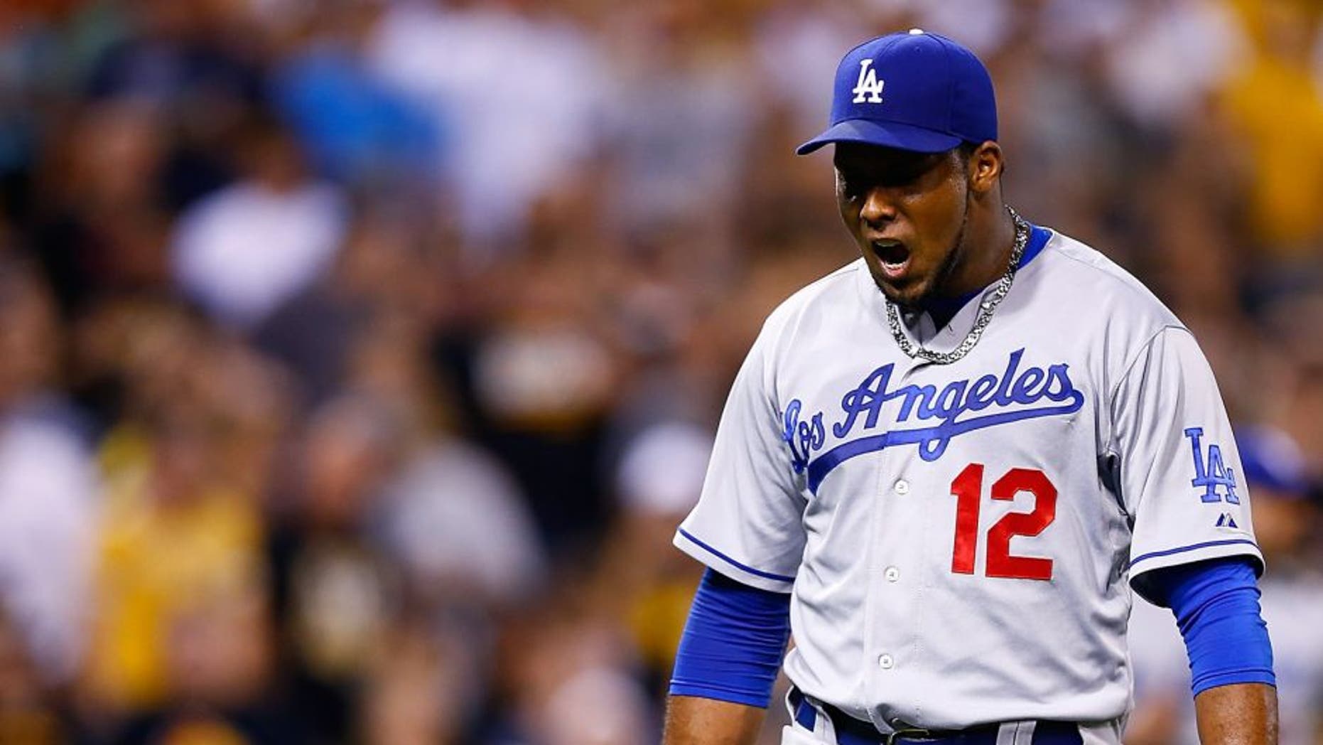 PITTSBURGH, PA - AUGUST 09: Juan Nicasio #12 of the Los Angeles Dodgers pitches against the Pittsburgh Pirates during the game at PNC Park on August 9, 2015 in Pittsburgh, Pennsylvania. (Photo by Jared Wickerham/Getty Images)