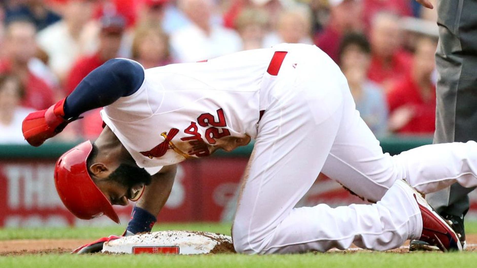 The St. Louis Cardinals' Jason Heyward pounds on the dirt after being thrown out trying to advance from first to third on a single by Yadier Molina in the first inning against the Pittsburgh Pirates on Thursday, Aug. 13, 2015, at Busch Stadium in St. Louis. The Pirates won, 10-5. (Chris Lee/St. Louis Post-Dispatch/TNS via Getty Images)