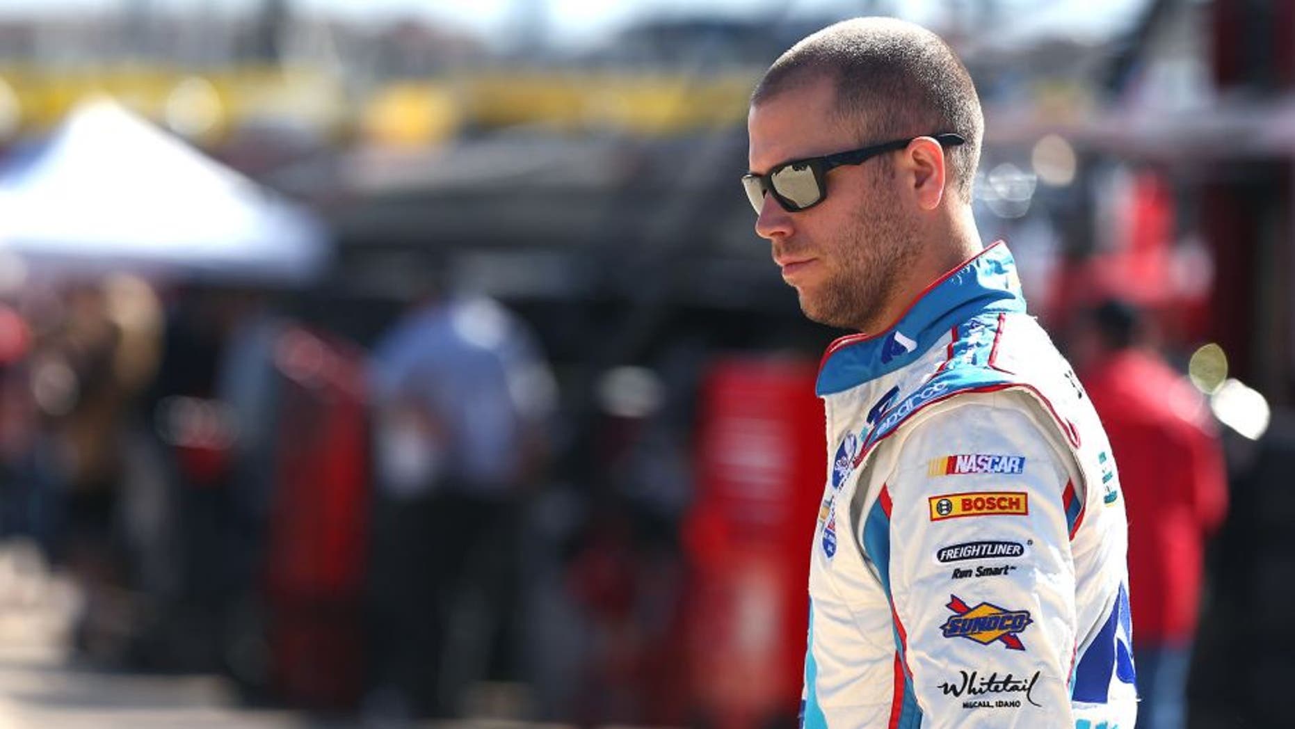 FORT WORTH, TX - NOVEMBER 06: Brian Scott, driver of the #33 Shore Lodge Chevrolet, walks in the garage area during practice for the NASCAR Sprint Cup Series AAA Texas 500 at Texas Motor Speedway on November 6, 2015 in Fort Worth, Texas. (Photo by Sarah Crabill/Getty Images for Texas Motor Speedway)