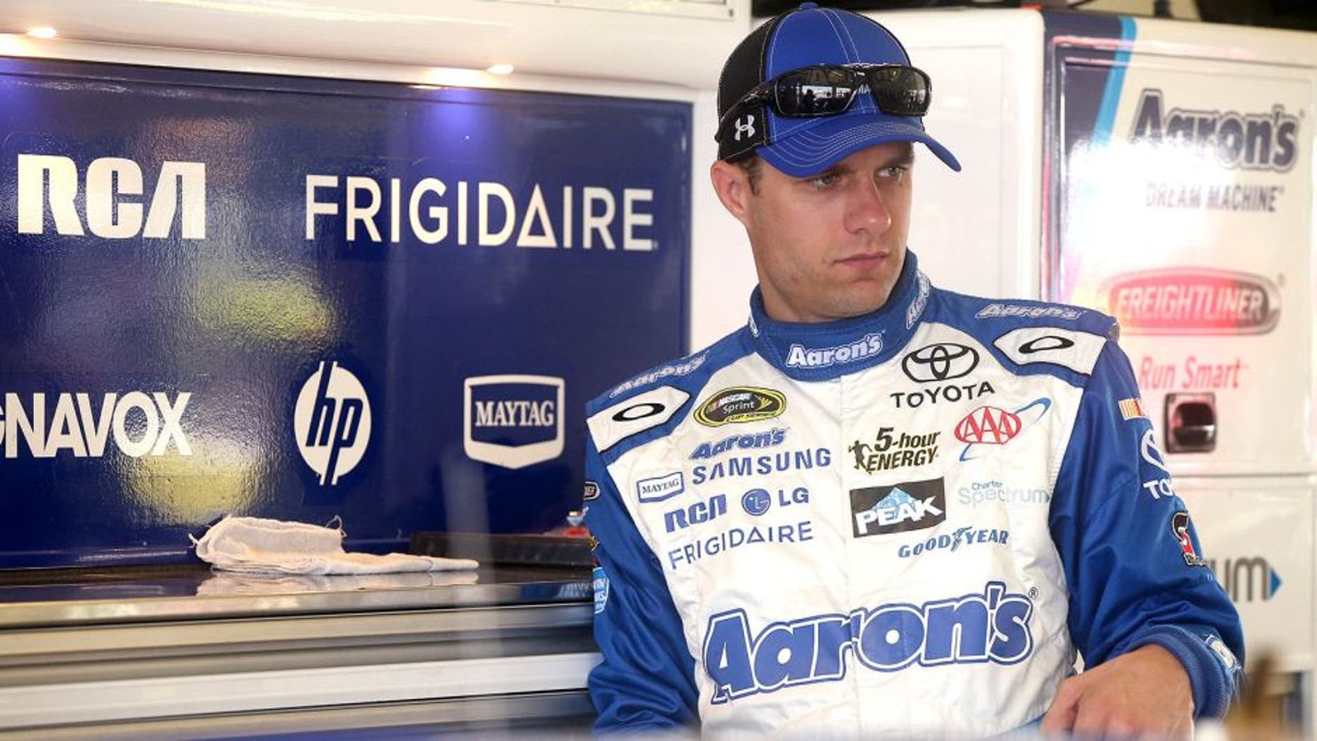 HOMESTEAD, FL - NOVEMBER 21: David Ragan, driver of the #55 Aaron's Online Dream Machine Toyota, stands in the garage area during practice for the NASCAR Sprint Cup Series Ford EcoBoost 400 at Homestead-Miami Speedway on November 21, 2015 in Homestead, Florida. (Photo by Sean Gardner/Getty Images)