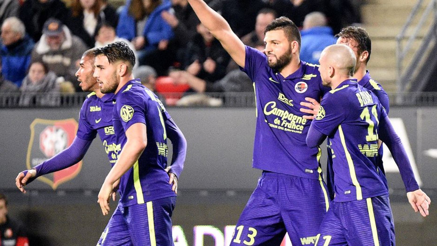 Caen's French defender Syam Ben Youssef (3-R) celebrates with teammates after scoring a goal during the French L1 football match Rennes against Caen on December 11, 2015 at the Roazhon park stadium in Rennes, western France. AFP PHOTO / DAMIEN MEYER / AFP / DAMIEN MEYER (Photo credit should read DAMIEN MEYER/AFP/Getty Images)