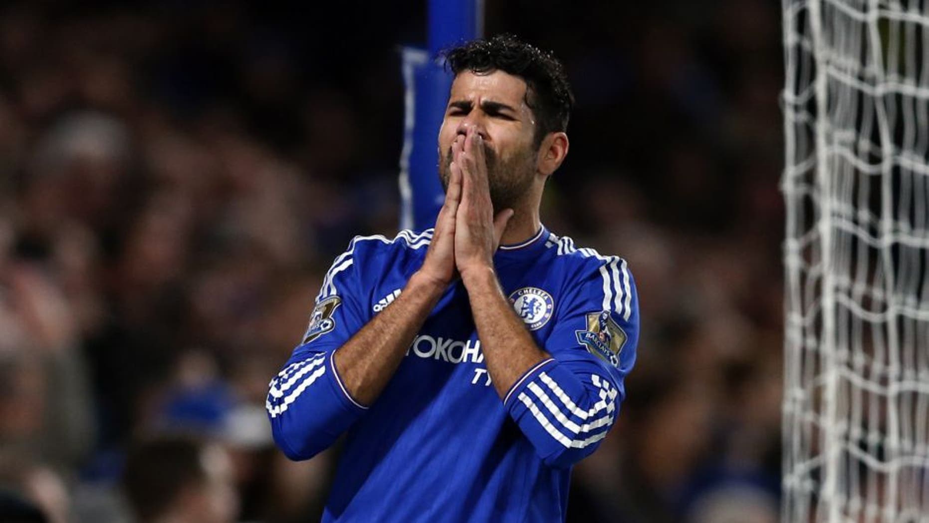 Chelsea's Brazilian-born Spanish striker Diego Costa reacts during the English Premier League football match between Chelsea and Bournemouth at Stamford Bridge in London on December 5, 2015. AFP PHOTO / JUSTIN TALLIS RESTRICTED TO EDITORIAL USE. No use with unauthorized audio, video, data, fixture lists, club/league logos or 'live' services. Online in-match use limited to 75 images, no video emulation. No use in betting, games or single club/league/player publications. / AFP / JUSTIN TALLIS (Photo credit should read JUSTIN TALLIS/AFP/Getty Images)
