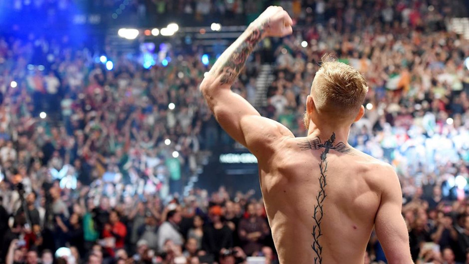 LAS VEGAS, NV - DECEMBER 11: UFC interim featherweight champion Conor McGregor of Ireland waves to the crowd after making weight during the UFC 194 weigh-in inside MGM Grand Garden Arena on December 10, 2015 in Las Vegas, Nevada. (Photo by Mike Roach/Zuffa LLC/Zuffa LLC via Getty Images)