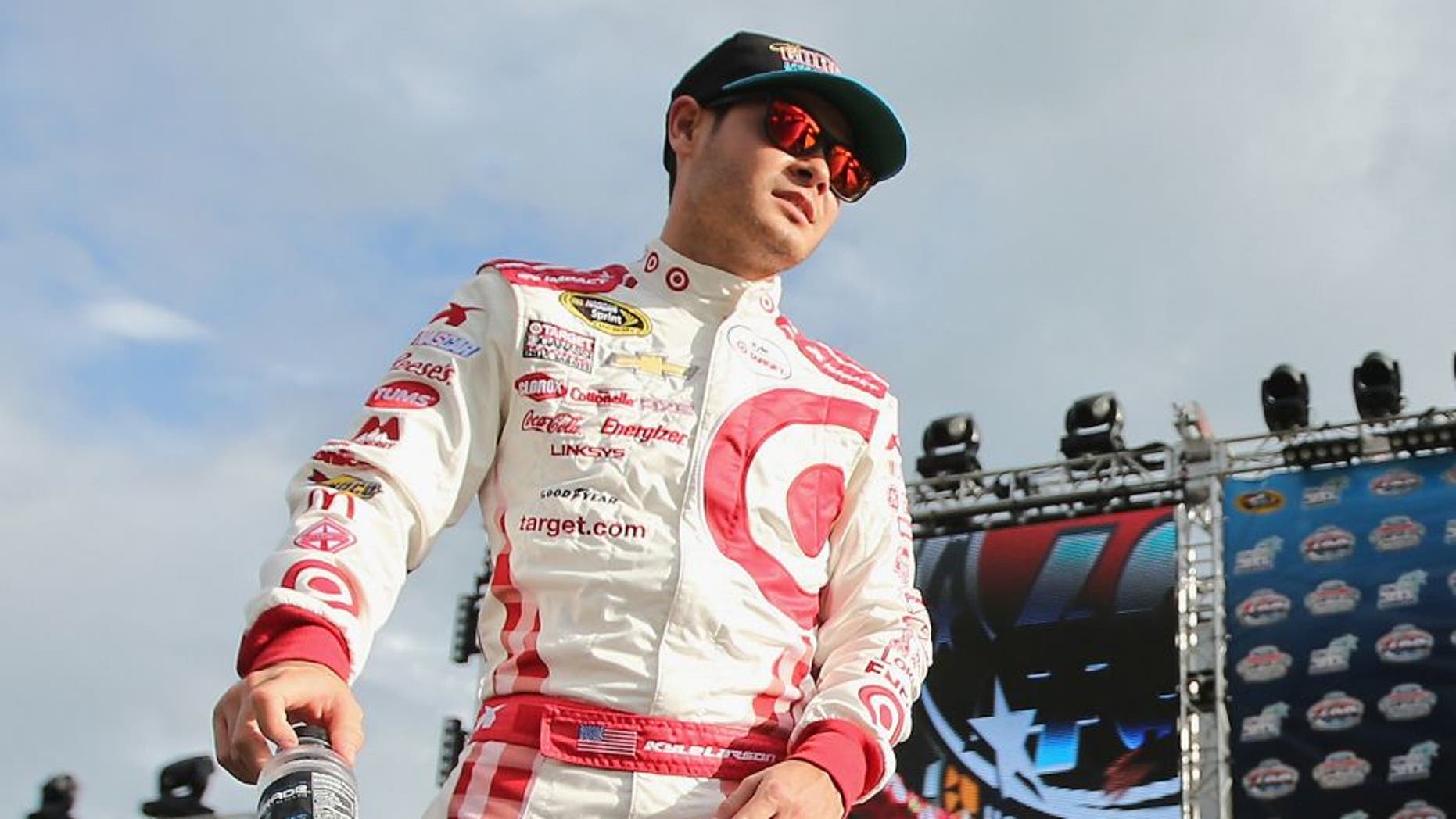 HOMESTEAD, FL - NOVEMBER 22: Kyle Larson, driver of the #42 Target Plaid Chevrolet, is introduced during pre-race ceremonies for the NASCAR Sprint Cup Series Ford EcoBoost 400 at Homestead-Miami Speedway on November 22, 2015 in Homestead, Florida. (Photo by Mike Ehrmann/Getty Images)