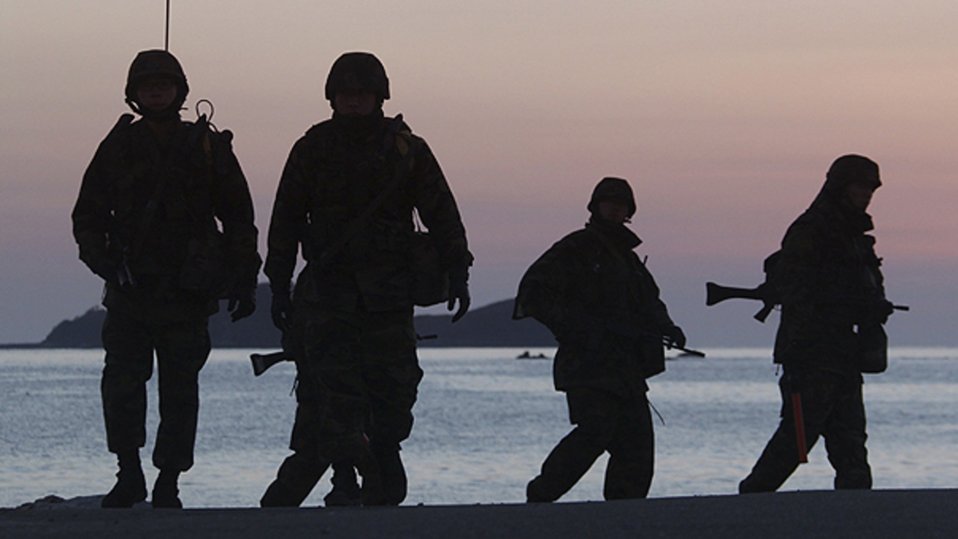 Dec. 10: South Korean marines patrol along the beach of Yeonpyeong Island, South Korea.