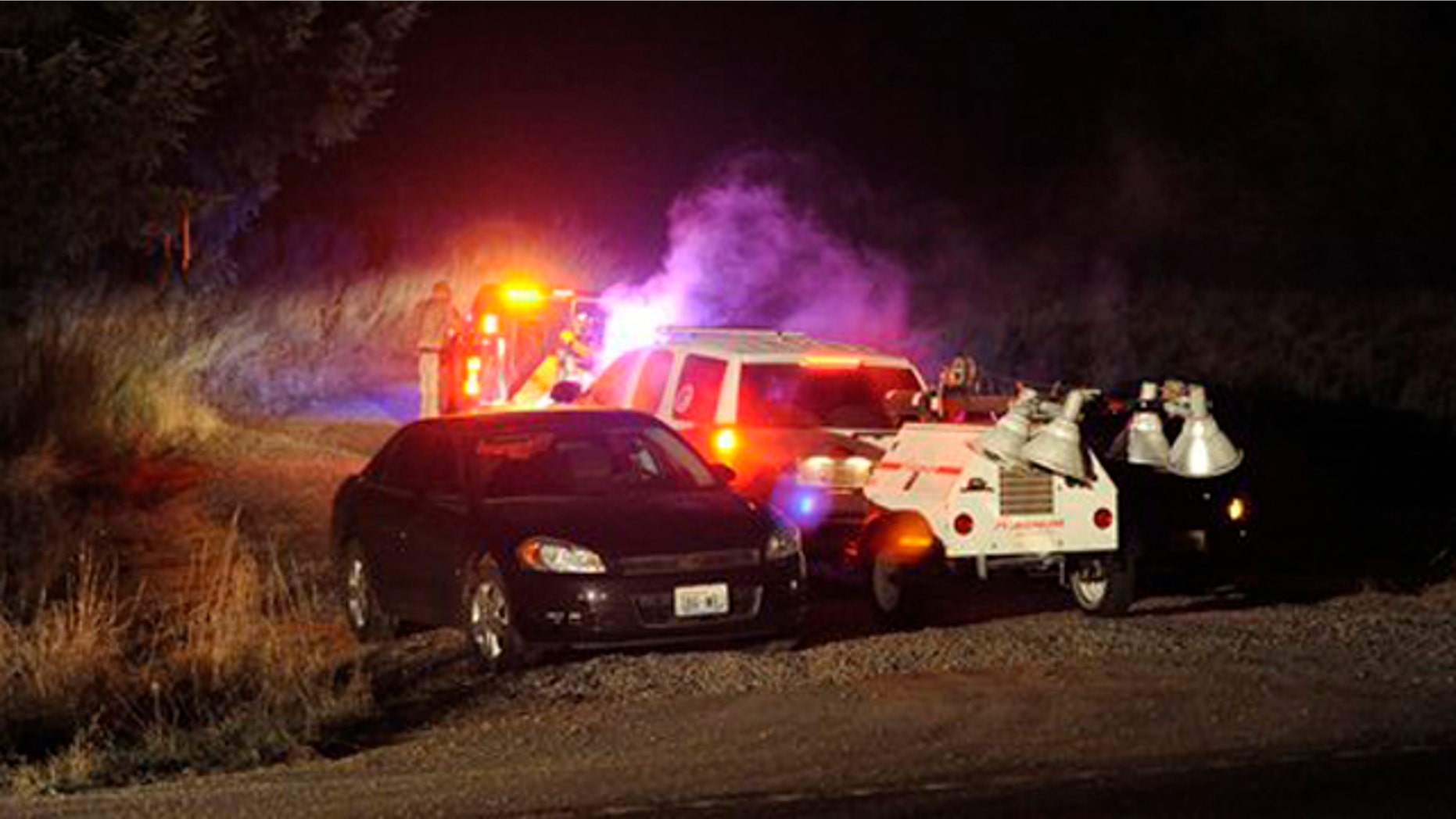 December 12, 2011: Crews enter the training area southwest of Joint Base Lewis-McChord, Wash., near the scene where two Army OH-58 Kiowa helicopters crashed, killing four soldiers.