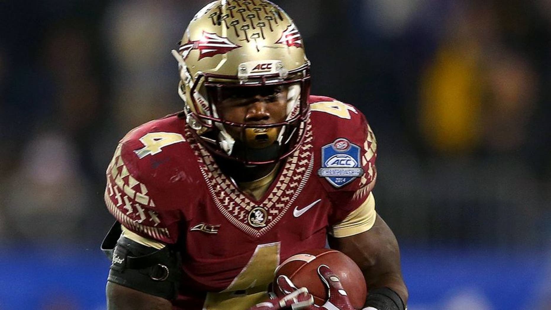 CHARLOTTE, NC - DECEMBER 06: Dalvin Cook #4 of the Florida State Seminoles runs the ball against the Georgia Tech Yellow Jackets in the 3rd quarter during the ACC Championship game on December 6, 2014 in Charlotte, North Carolina. (Photo by Mike Ehrmann/Getty Images)
