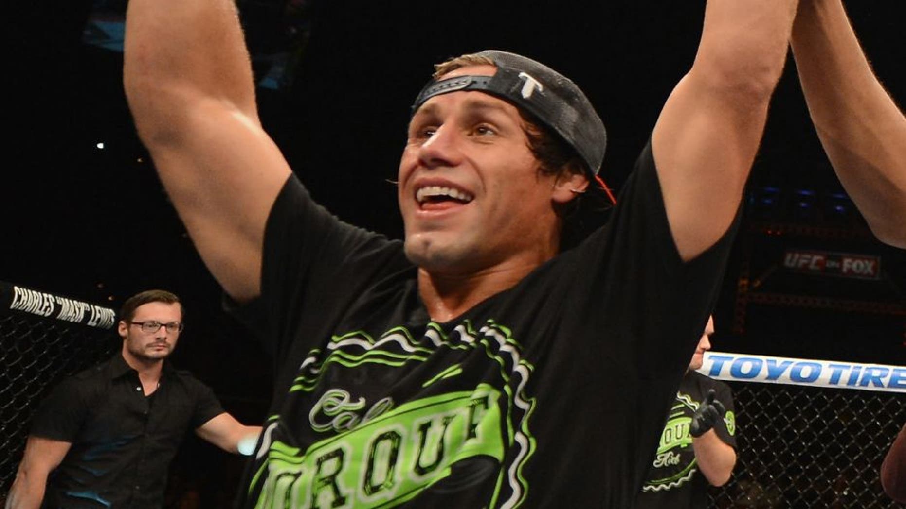 LAS VEGAS, NV - JULY 05: Uriah Faber celebrates his submission win over Alex Caceres in their bantamweight fight at UFC 175 inside the Mandalay Bay Events Center on July 5, 2014 in Las Vegas, Nevada. (Photo by Donald Miralle/Zuffa LLC/Zuffa LLC via Getty Images)