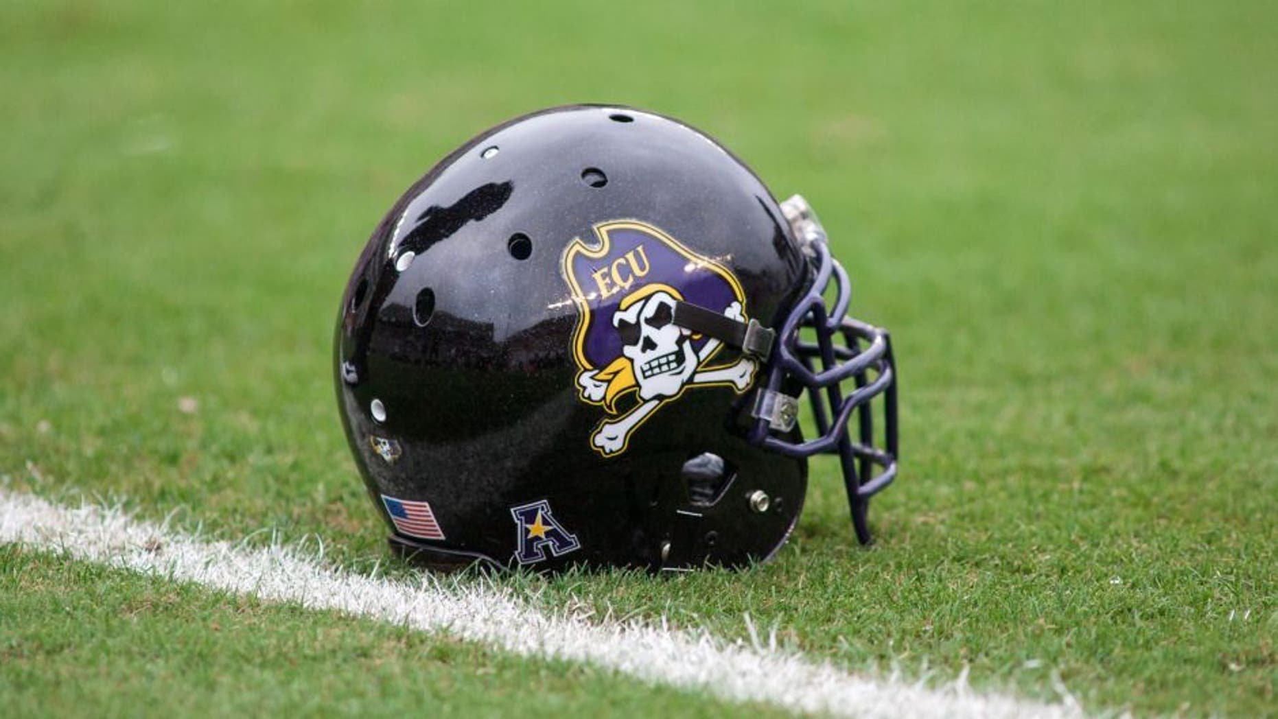 Sep 13, 2014; Blacksburg, VA, USA; East Carolina Pirates helmet lays on the field during the warms ups prior to the game against the Virginia Tech Hokies at Lane Stadium. Mandatory Credit: Jeremy Brevard-USA TODAY Sports