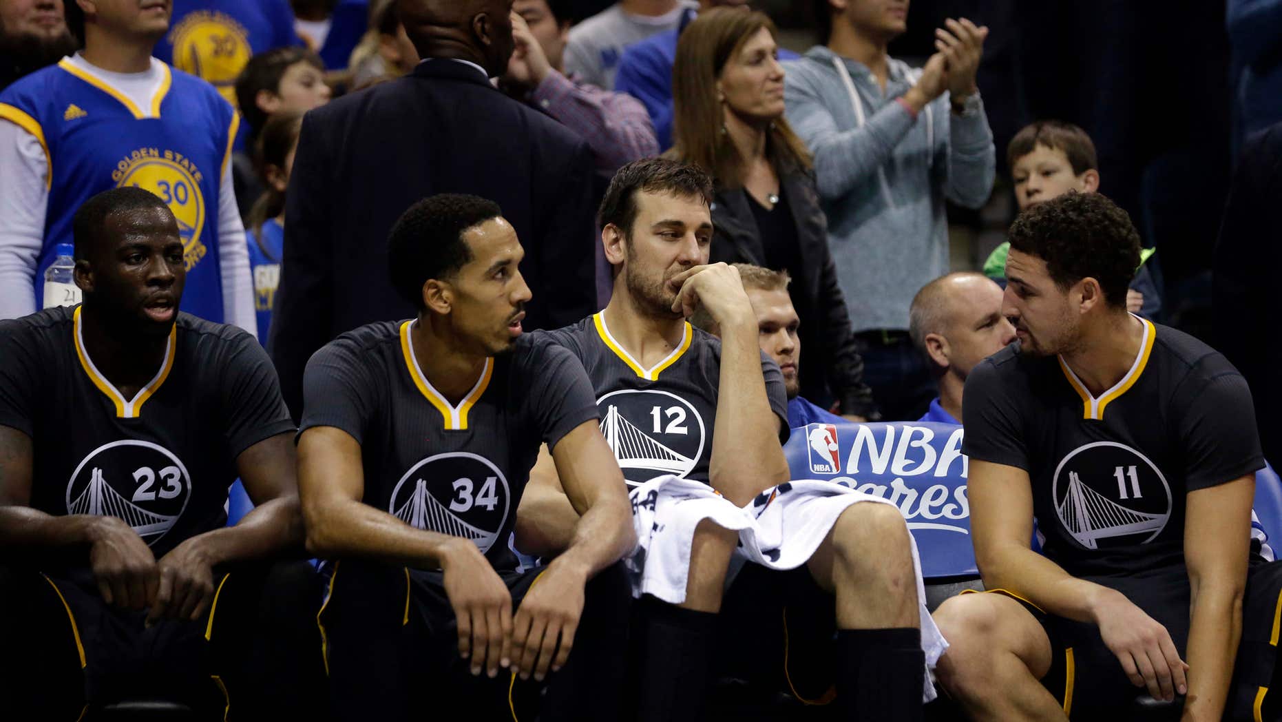 Dec. 12, 2015: Golden State Warriors' Andrew Bogut (12), Klay Thompson (11), Shaun Livingston (34), and Draymond Green (23) talk on the bench during the second half of an NBA basketball game against the Milwaukee Bucks