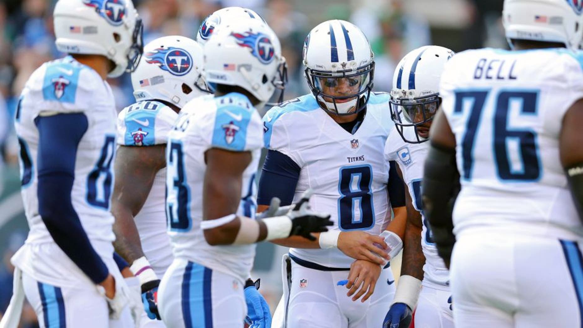 Dec 13, 2015; East Rutherford, NJ, USA; Tennessee Titans quarterback Marcus Mariota (8) in the huddle against the New York Jets during the first quarter at MetLife Stadium. Mandatory Credit: Brad Penner-USA TODAY Sports