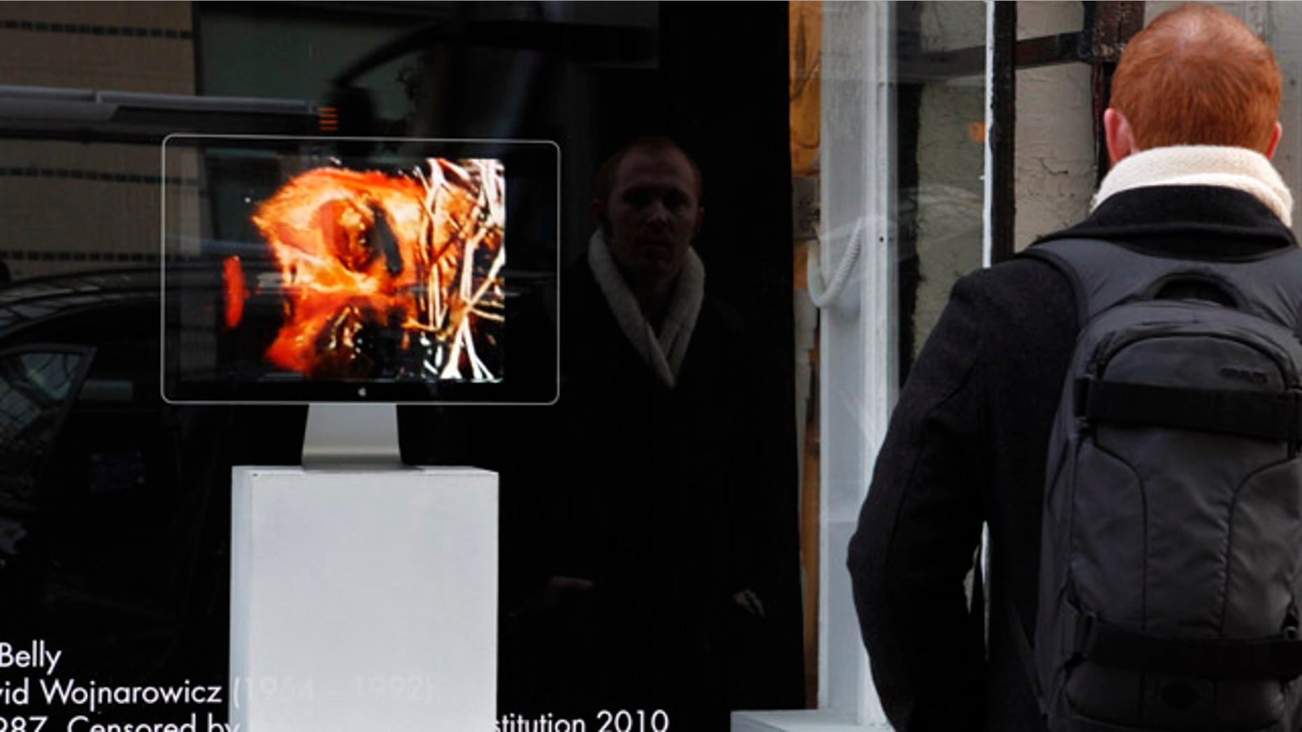 Dec. 2: A man watches the video, "A Fire in My Belly" outside the Transformer Gallery in Washington.