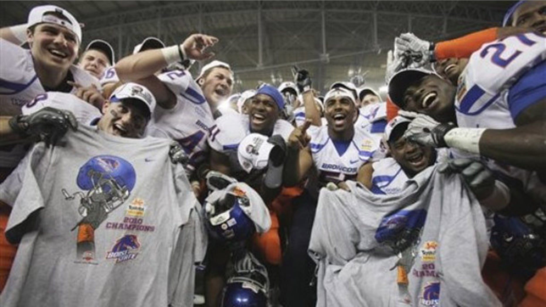 Boise State players celebrate their victory over TCU after the Fiesta Bowl NCAA college football game Monday, Jan. 4, 2010, in Glendale, Ariz.