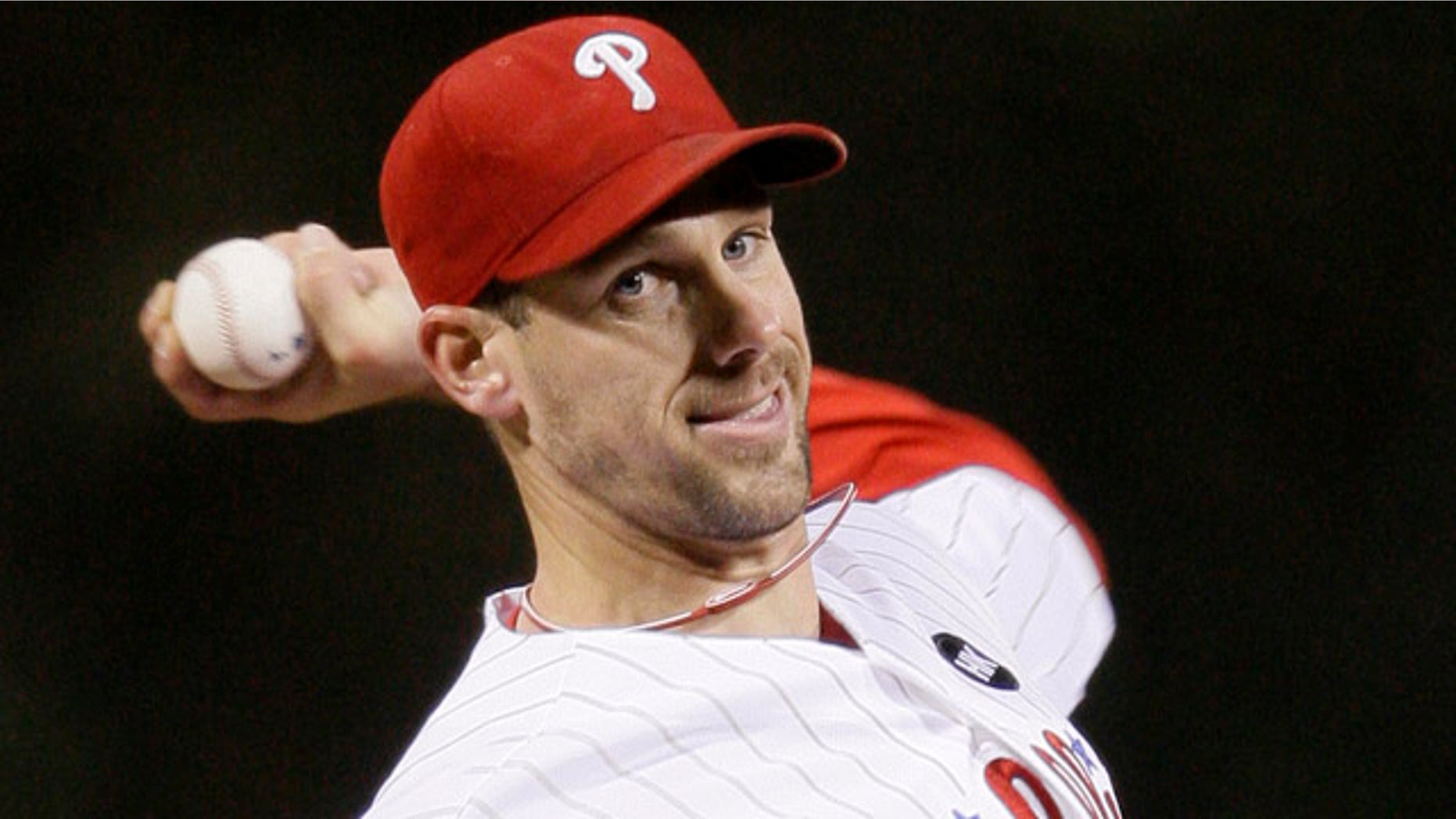 In an Oct. 18, 2009, file photo, Philadelphia Phillies' Cliff Lee pitches against the Los Angeles Dodgers in the first inning of Game 3 of the National League Championship baseball series in Philadelphia.