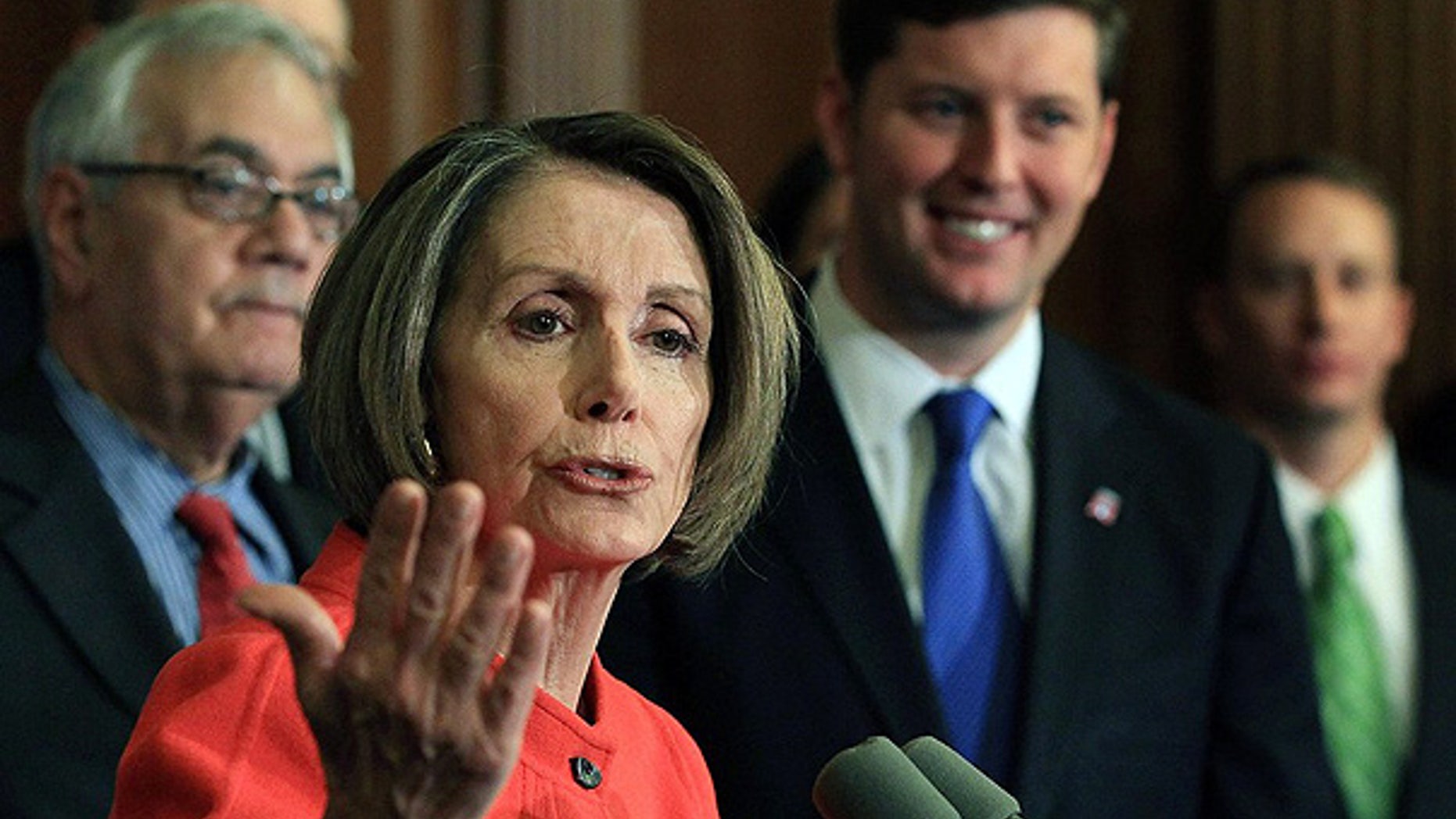 Dec. 15: House Speaker Nancy Pelosi is flanked by Rep. Barney Frank, left, and Rep. Patrick Murphy during a news conference on Capitol Hill.