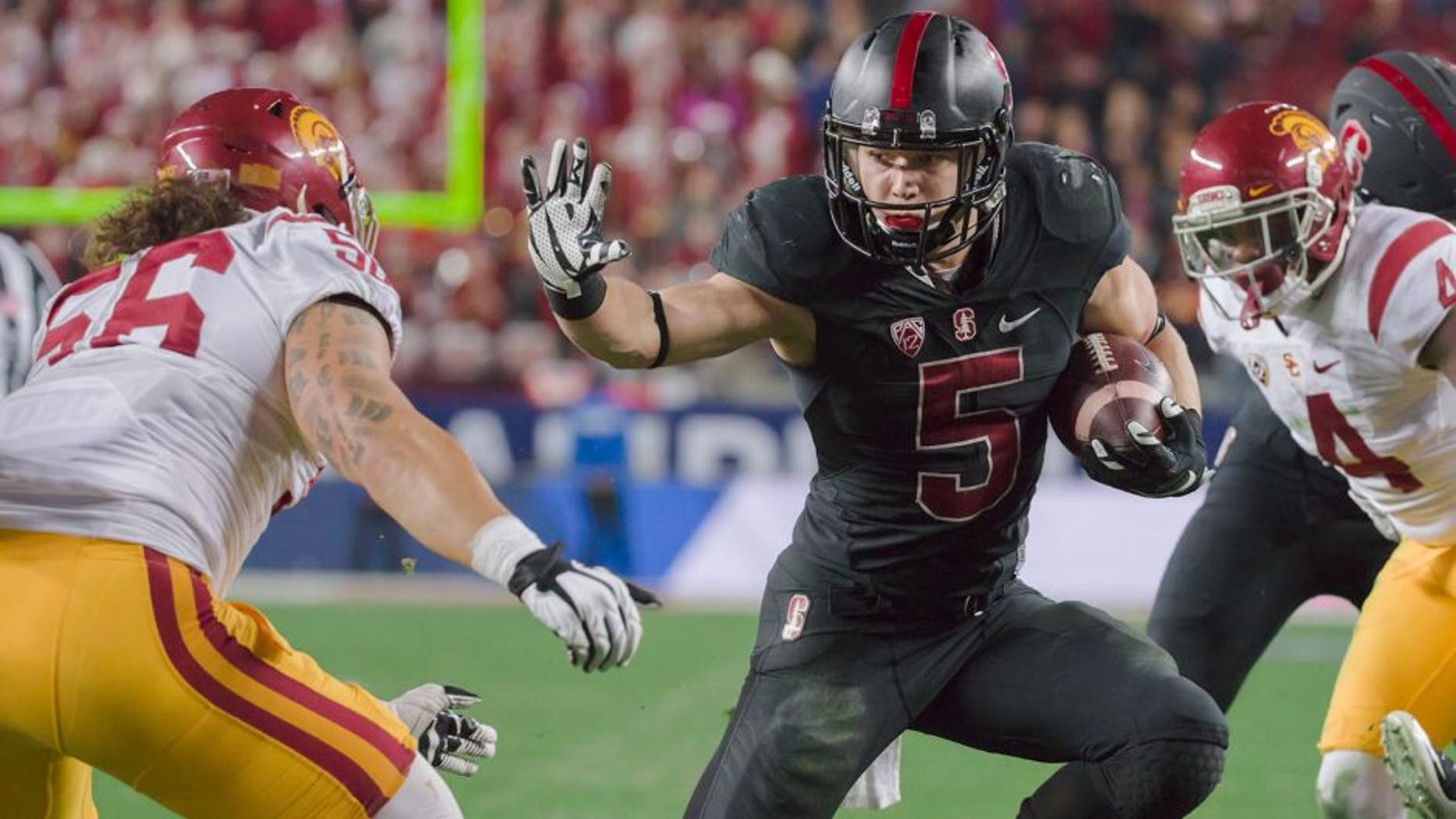 SANTA CLARA, CA - DECEMBER 5: Christian McCaffrey #5 of the Stanford Cardinal runs with the ball during the Pac-12 Championship Game against the USC Trojans played on December 5, 2015 at Levi's Stadium in Santa Clara, California. Visible at left is Anthony Sarao #56 of USC. (Photo by David Madison/Getty Images)