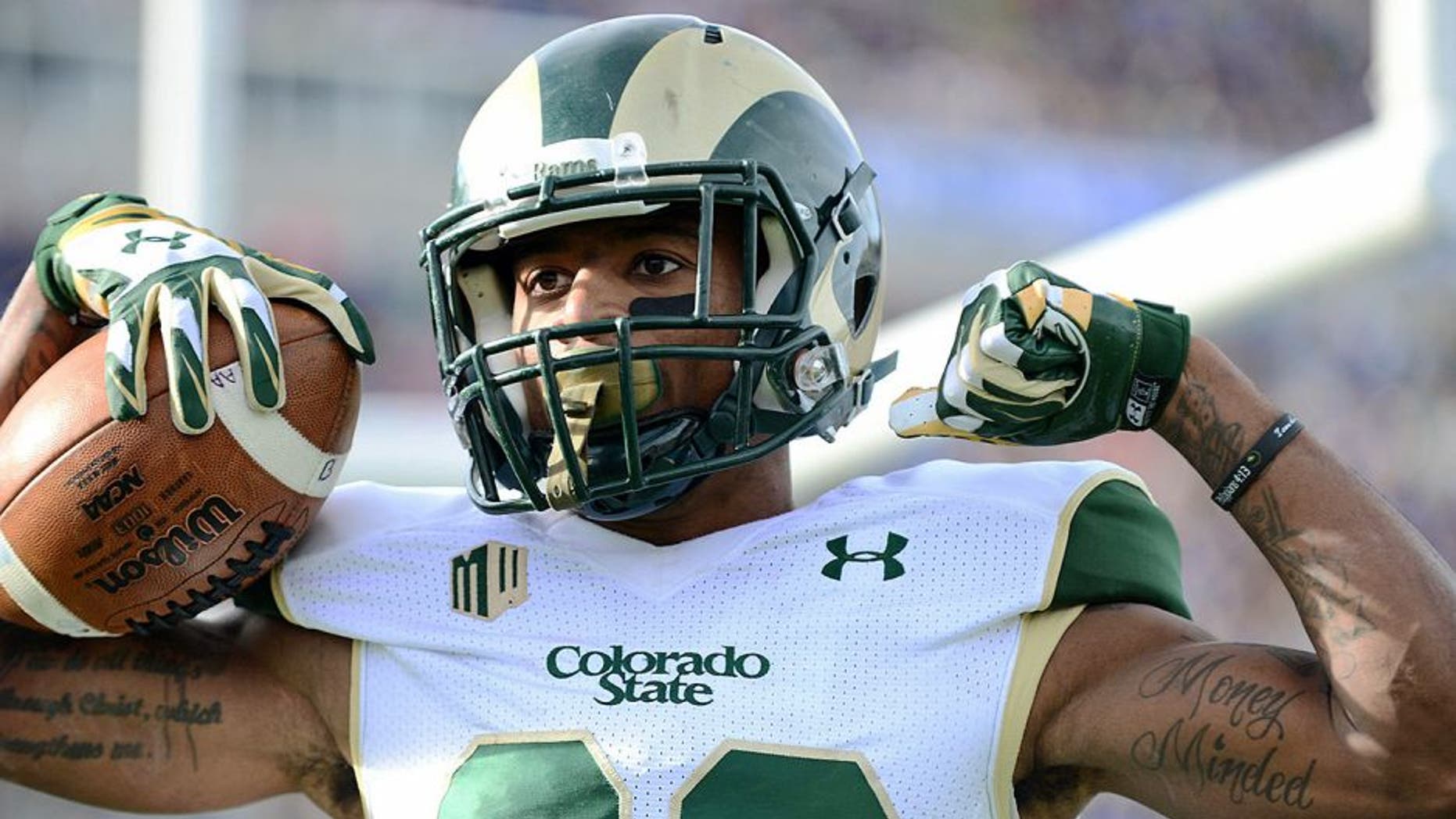 Nov 28, 2014; Colorado Springs, CO, USA; Colorado State Rams wide receiver Rashard Higgins (82) celebrates his touchdown reception in the first quarter against the Air Force Falcons at Falcon Stadium. Mandatory Credit: Ron Chenoy-USA TODAY Sports