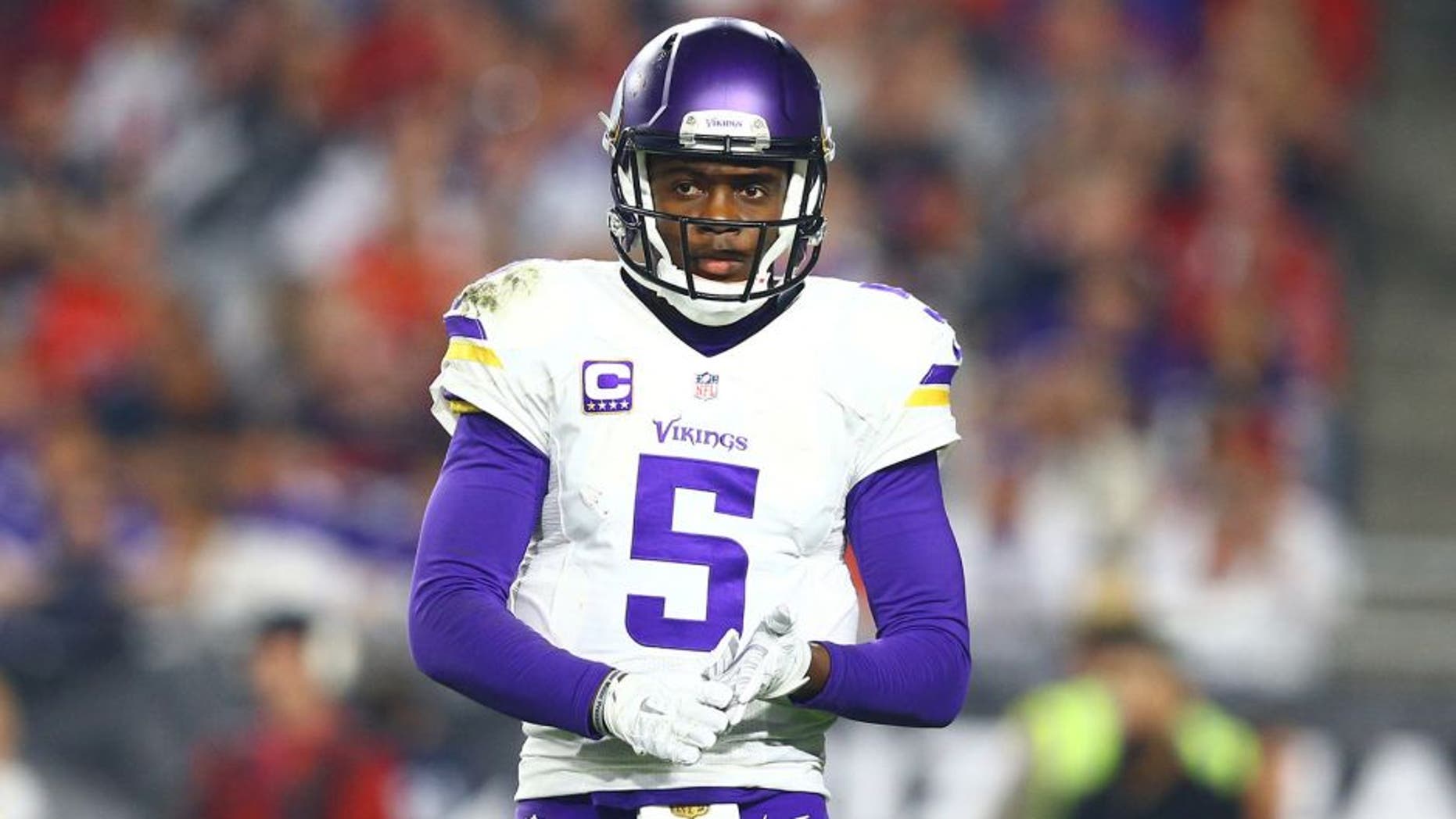 Dec 10, 2015; Glendale, AZ, USA; Minnesota Vikings quarterback Teddy Bridgewater (5) reacts in the second half against the Arizona Cardinals at University of Phoenix Stadium. The Cardinals defeated the Vikings 23-20. Mandatory Credit: Mark J. Rebilas-USA TODAY Sports