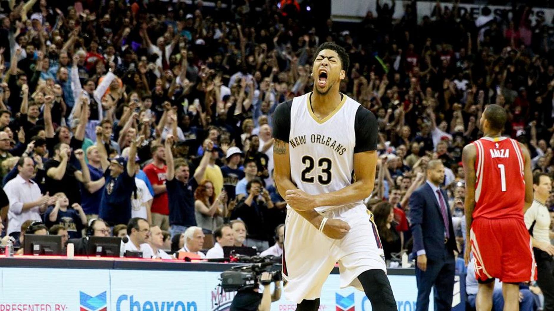 Dec 26, 2015; New Orleans, LA, USA; New Orleans Pelicans forward Anthony Davis (23) celebrates after defeating the Houston Rockets 110-108 at the Smoothie King Center. Mandatory Credit: Derick E. Hingle-USA TODAY Sports