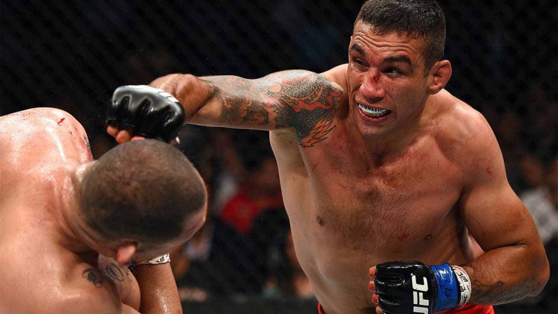 MEXICO CITY, MEXICO - JUNE 13: (R-L) Fabricio Werdum punches Cain Velasquez in their UFC heavyweight championship bout during the UFC 188 event inside the Arena Ciudad de Mexico on June 13, 2015 in Mexico City, Mexico. (Photo by Josh Hedges/Zuffa LLC/Zuffa LLC via Getty Images)