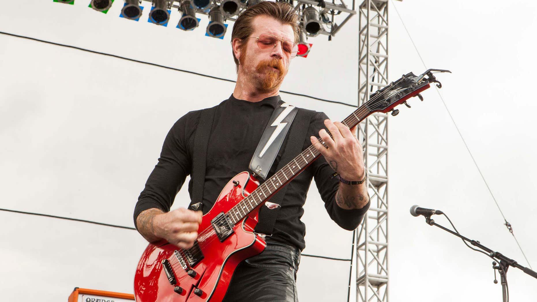 FILE - In this Sept. 11, 2015 file photo, Jesse Hughes of Eagles of Death Metal performs at Riot Fest & Carnival in Chicago.