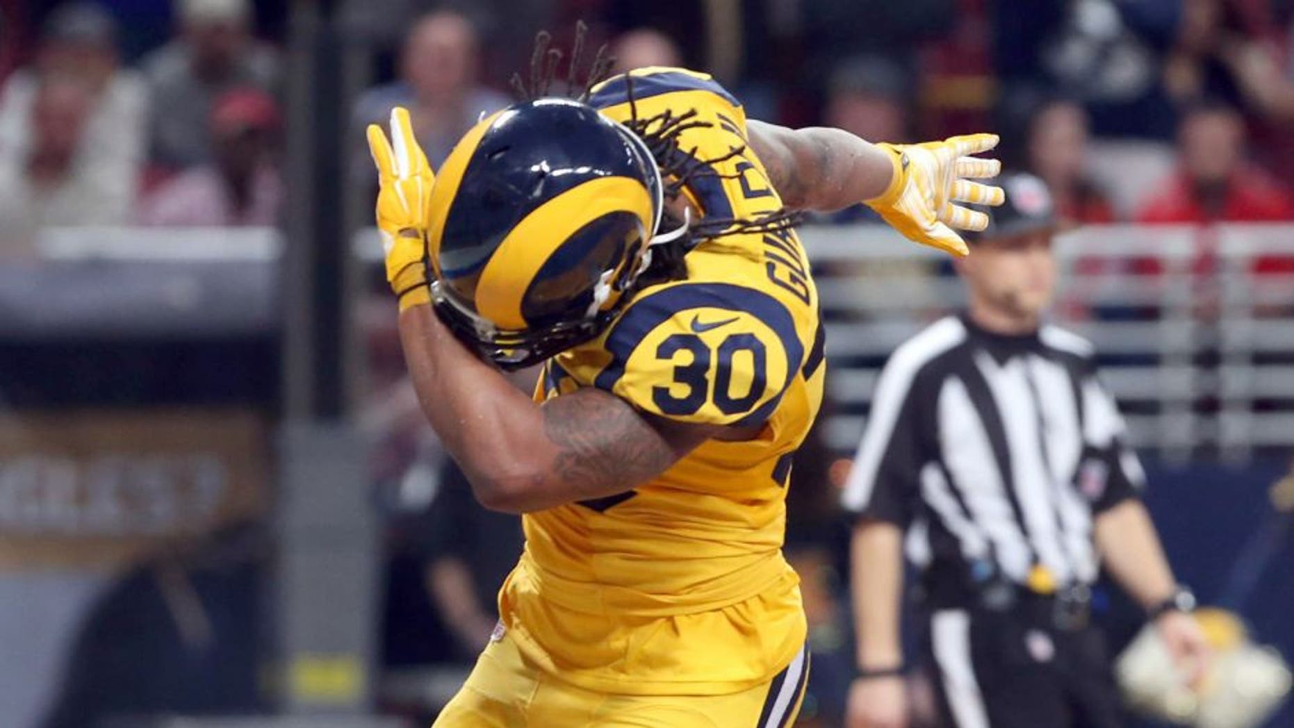 Dec 17, 2015; St. Louis, MO, USA; St. Louis Rams running back Todd Gurley (30) reacts to scoring a touchdown in the first half against the Tampa Bay Buccaneers at the Edward Jones Dome. Mandatory Credit: Aaron Doster-USA TODAY Sports