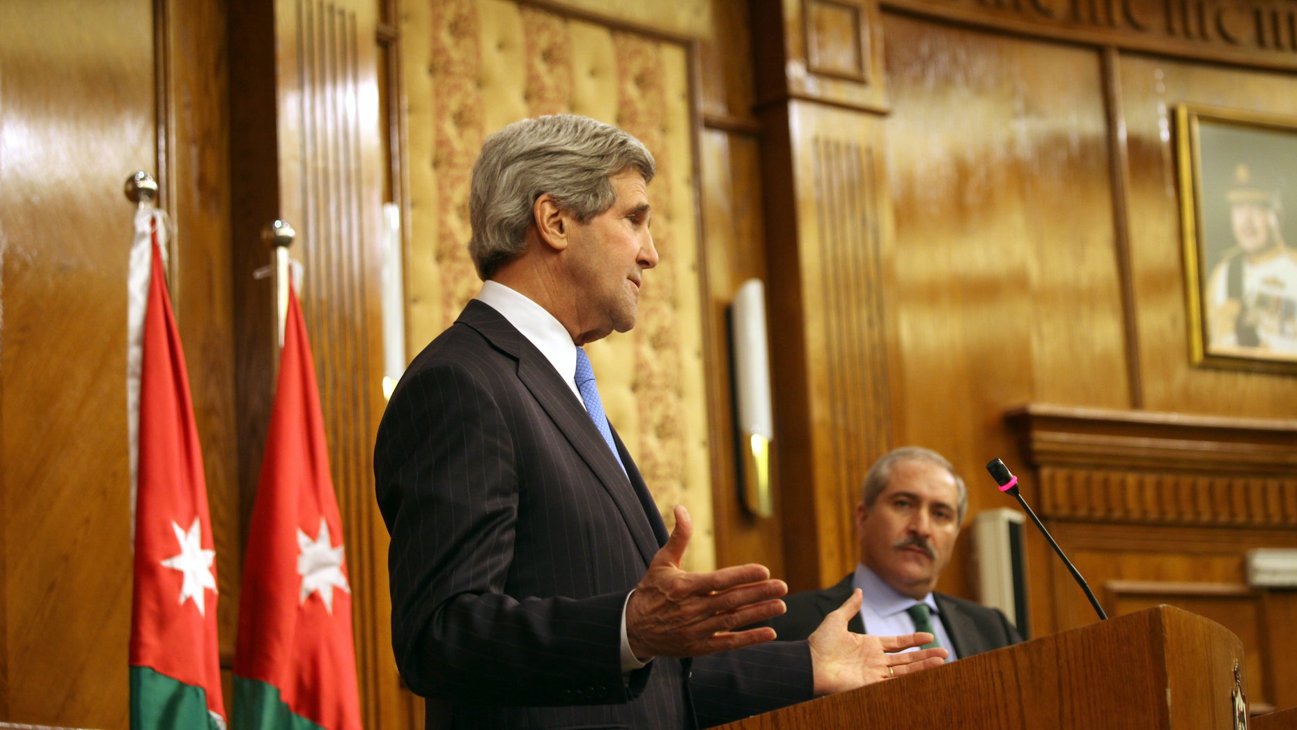 U.S. Secretary of State John Kerry, left, speaks during a joint news conference with his Jordanian counterpart, Nasser Judeh, right, in Amman Wednesday, May 22, 2013. Secretary of State John Kerry says the United States and its Arab and European allies will step up their support for Syria’s opposition to help them “fight for the freedom of their country” if President Bashar Assad’s regime doesn’t engage in peace talks in good faith. (AP Photo/Mohammad Hannon)