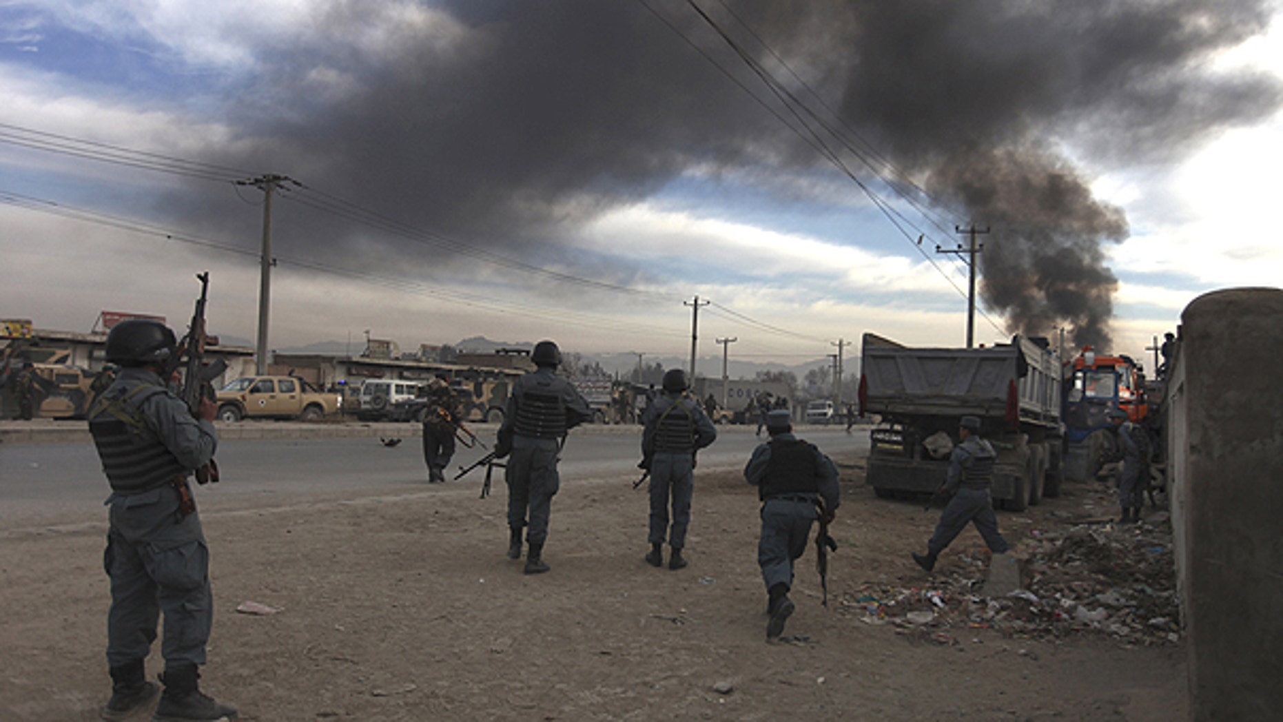 Dec. 19: Afghan soldiers take positions near the site of a gunbattle on the outskirts of Kabul, Afghanistan.