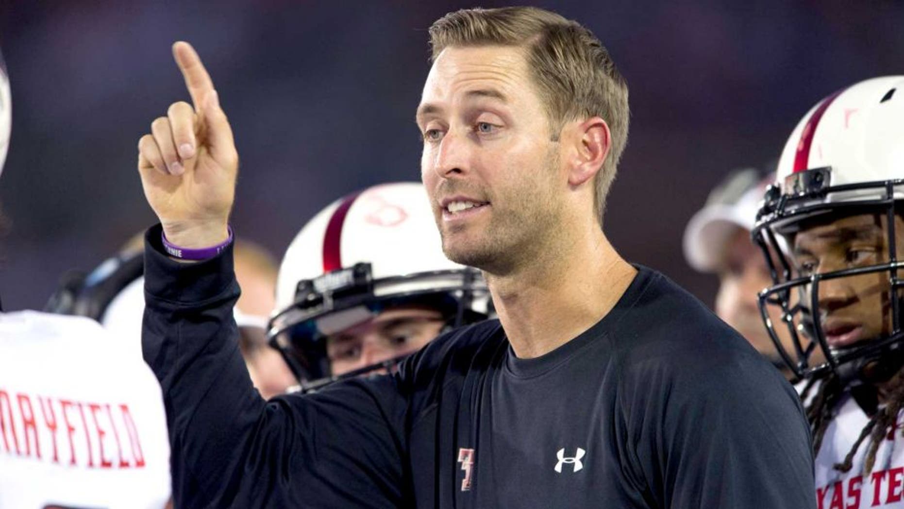 DALLAS, TX - AUGUST 30: Head coach Kliff Kingsbury of the Texas Tech Red Raiders has words with his team against the SMU Mustangs on August 30, 2013 at Gerald J. Ford Stadium in Dallas, Texas. (Photo by Cooper Neill/Getty Images)