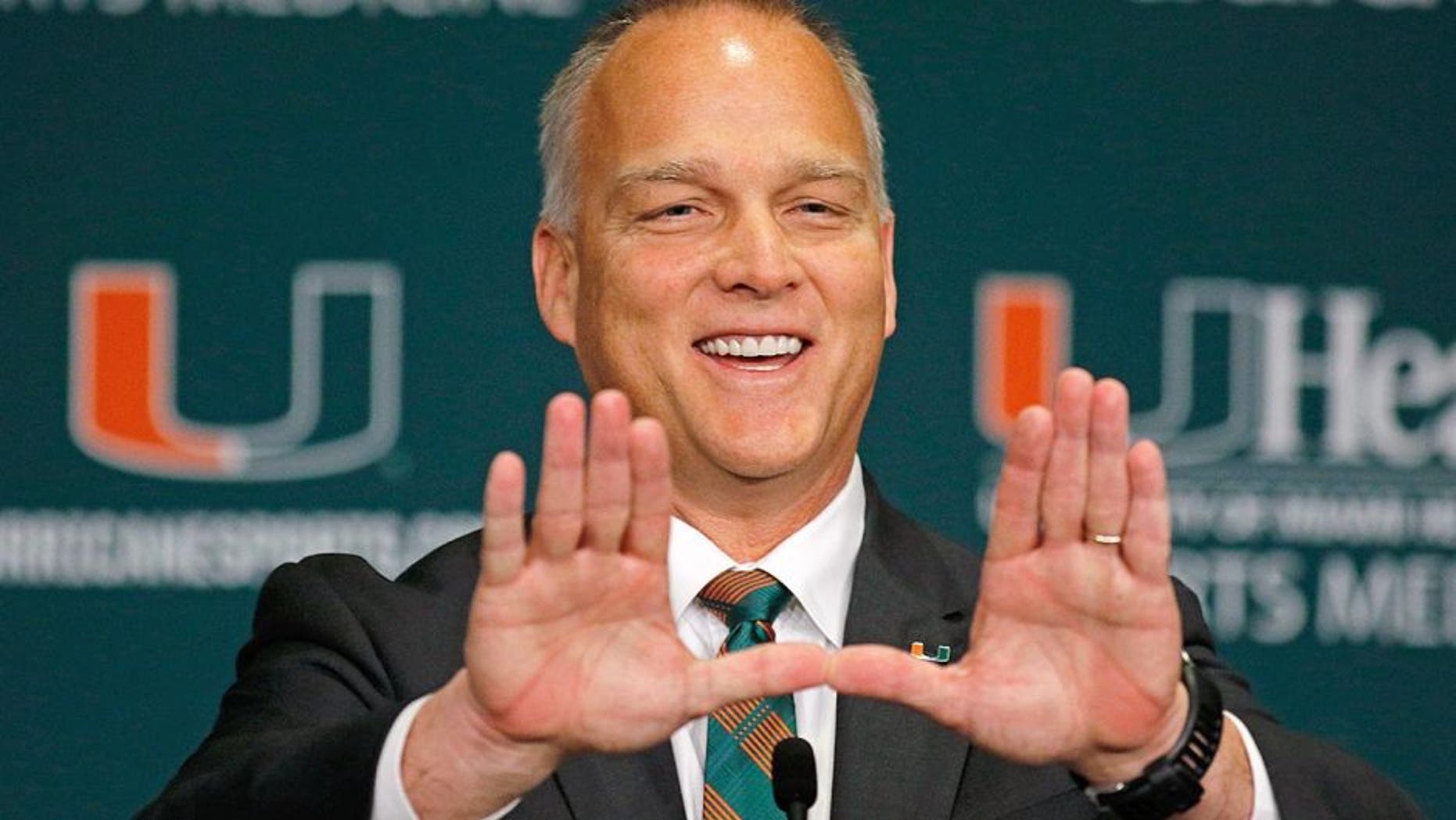 CORAL GABLES, FL - DECEMBER 04: New University of Miami Hurricanes head coach Mark Richt makes the 'U' sign after he was introduced at a press conference at the school on December 4, 2015 in Coral Gables, Florida. (Photo by Joe Skipper/Getty Images)