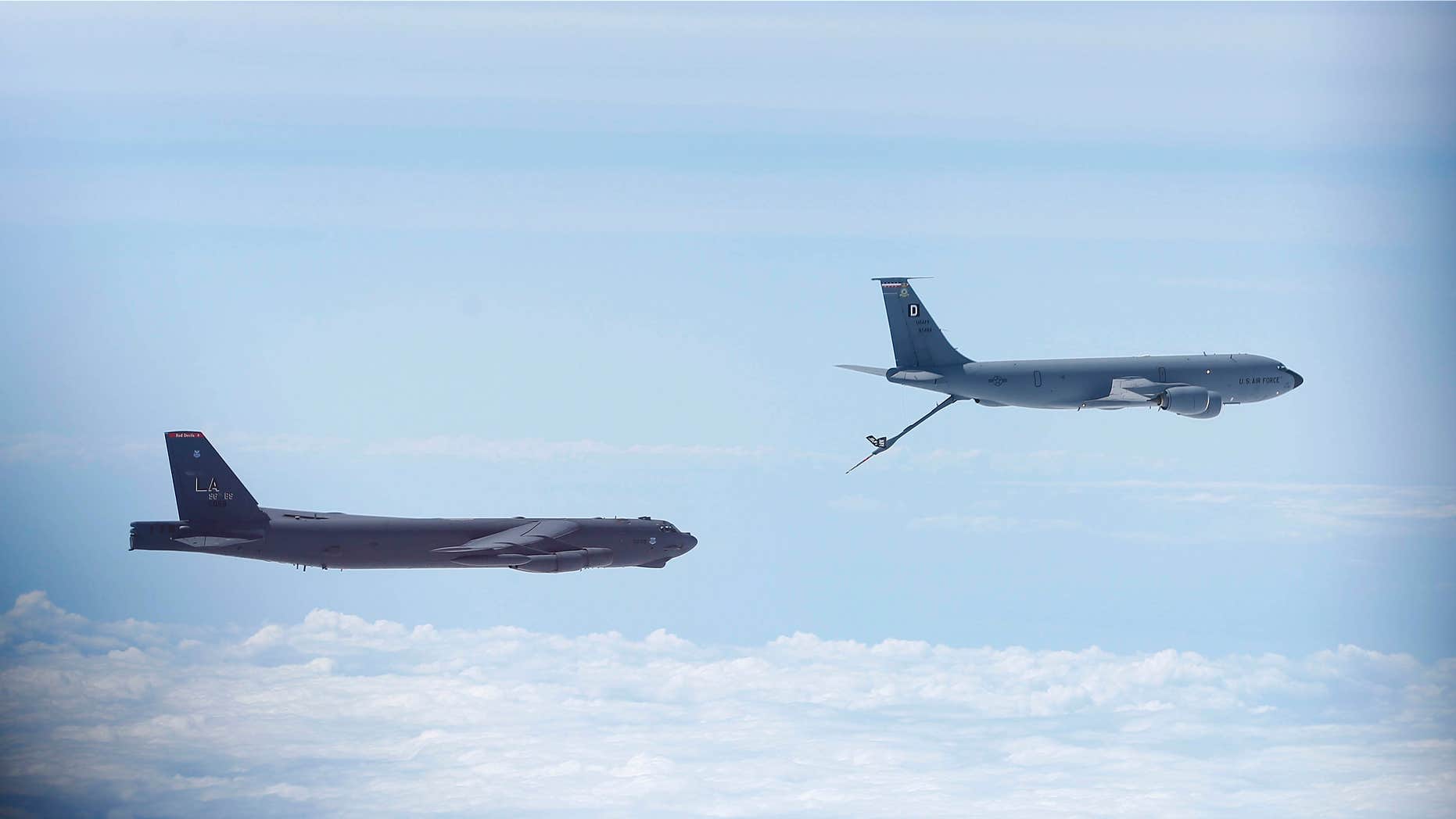 June 17, 2014: A U.S. Air Force B-52 is seen through the window of another as it prepares for a mid-air refuel during a training mission in the United Kingdom's airspace.