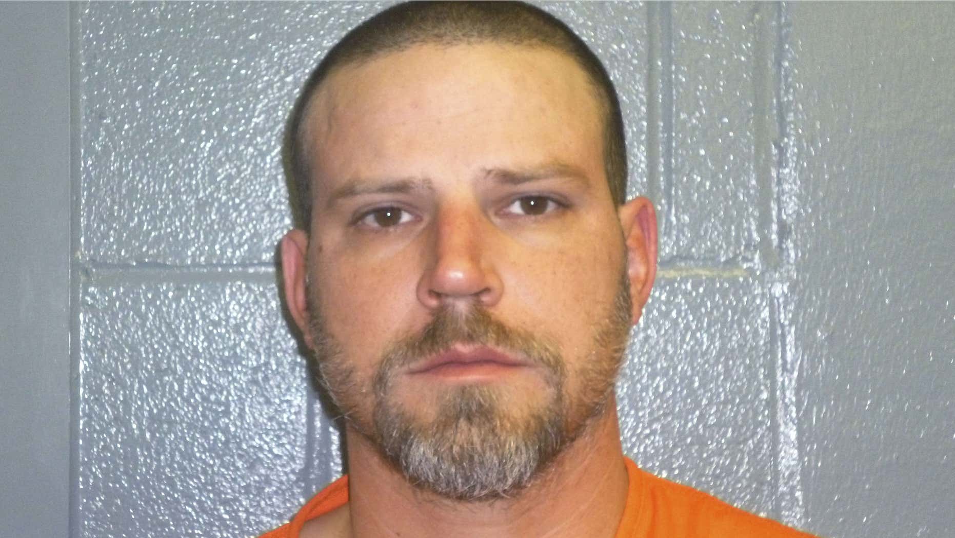 This Dec. 9, 2015, booking photo provided by the Custer County, Okla., Sheriff's Office shows Jeremy Doss Hardy, who was arrested for DUI after a brief pursuit on Interstate 40 in Custer County, Okla.