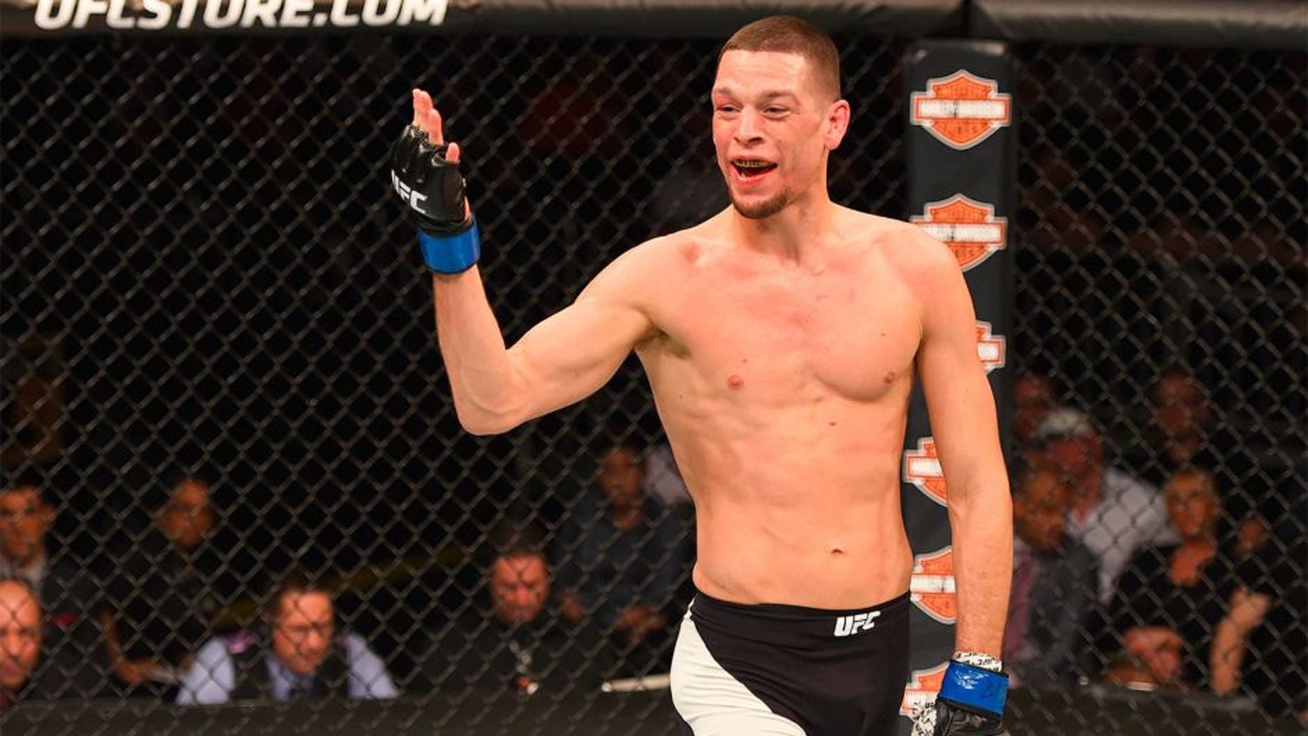 ORLANDO, FL - DECEMBER 19: Nate Diaz taunts Michael Johnson in their lightweight bout during the UFC Fight Night event at the Amway Center on December 19, 2015 in Orlando, Florida. (Photo by Josh Hedges/Zuffa LLC/Zuffa LLC via Getty Images)