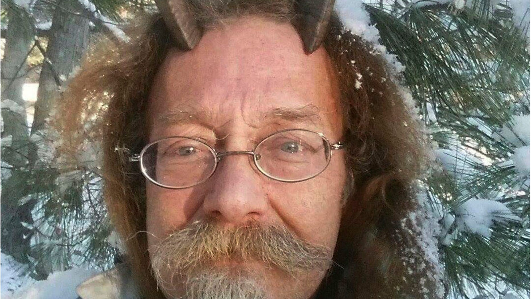 This Dec. 7, 2016, photo provided by Phelan Moonsong shows a portrait of himself in Portland, Maine. Moonsong, an ordained Pagan priest, finally has gotten the OK to sport goat horns in his Maine driver's license photo.